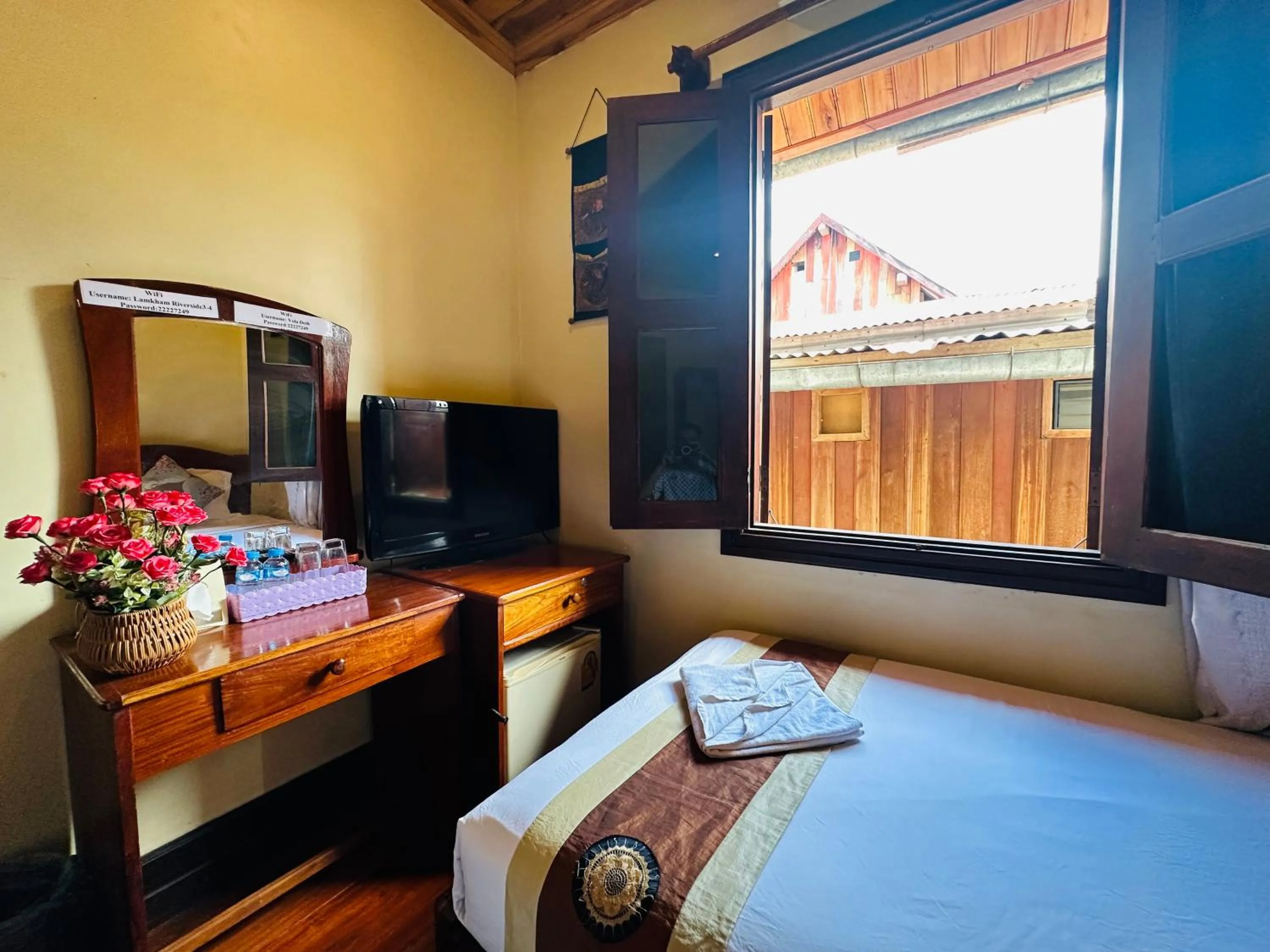 Communal lounge/ TV room, Bed in Anisa Mekong Riverside Villa