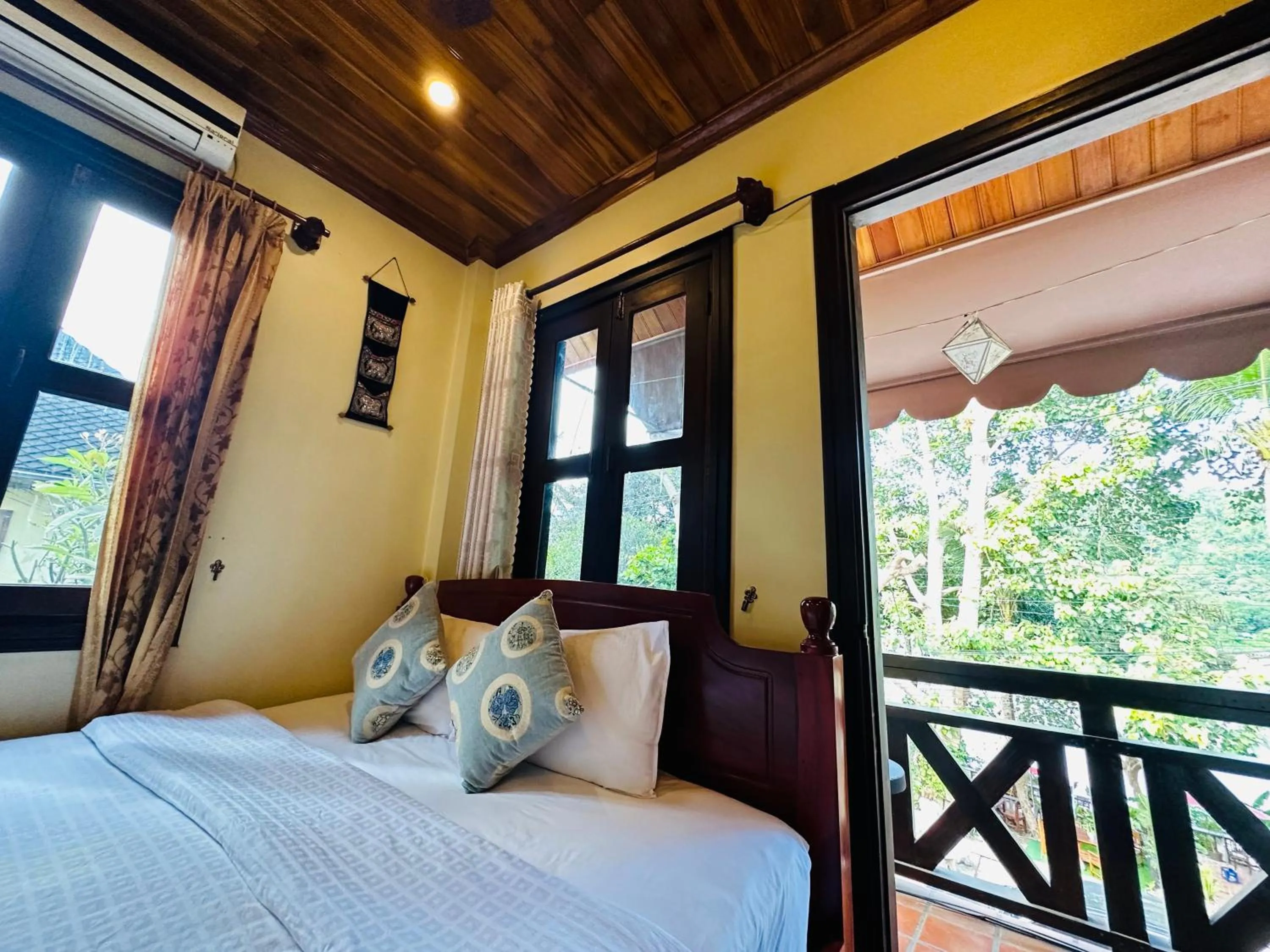 Bed in Anisa Mekong Riverside Villa
