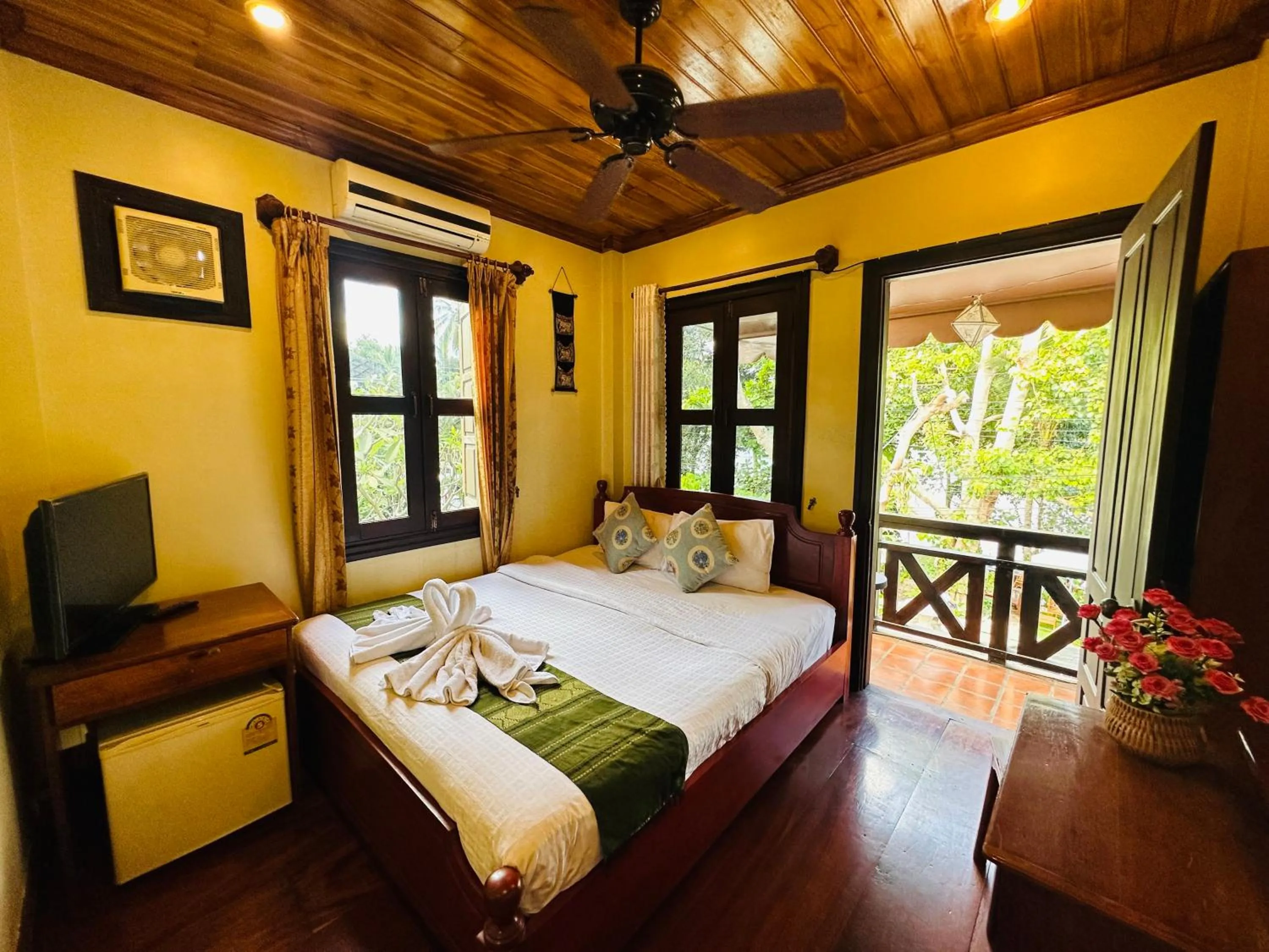 Communal lounge/ TV room, Bed in Anisa Mekong Riverside Villa