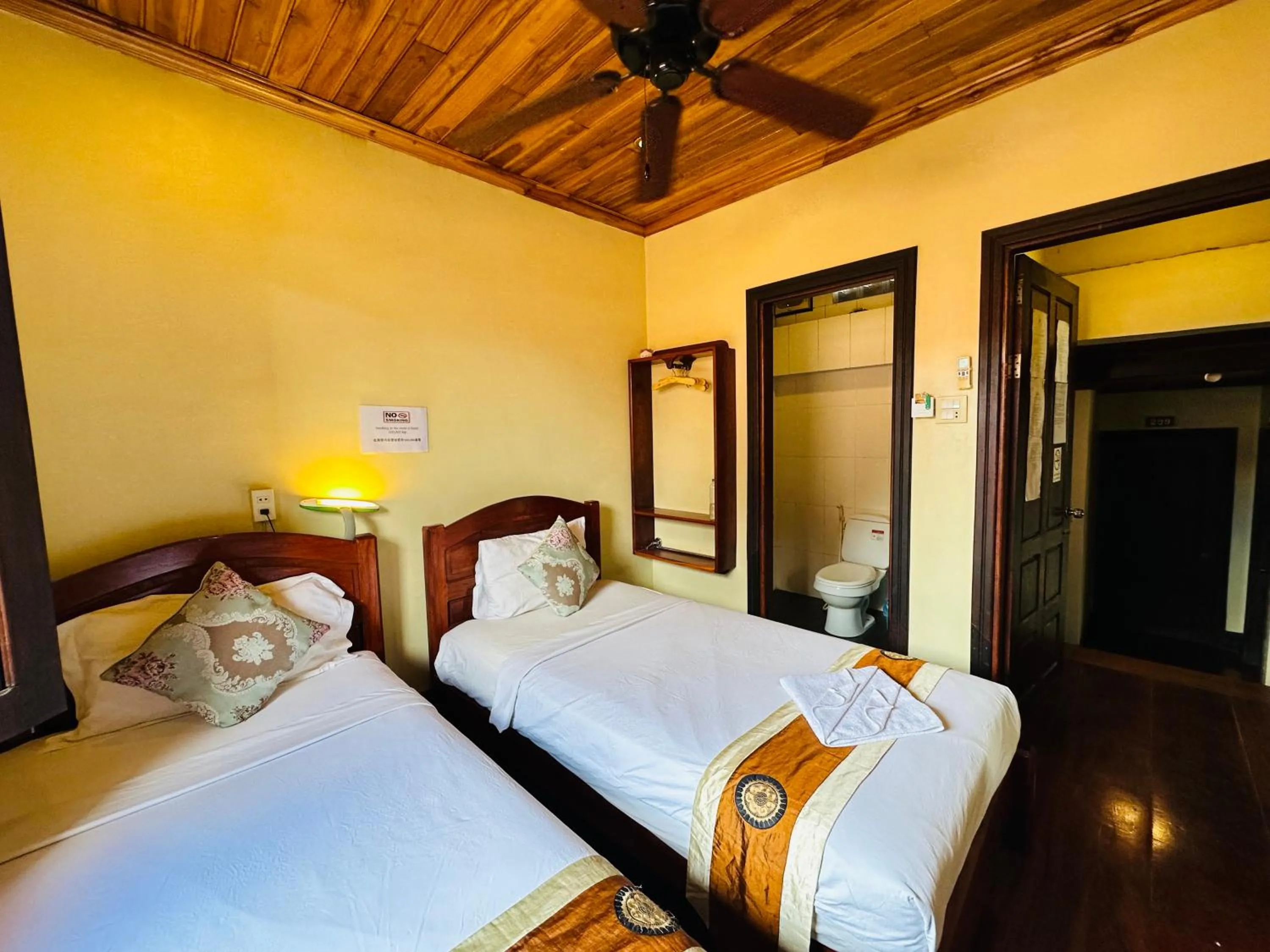 Bed in Anisa Mekong Riverside Villa