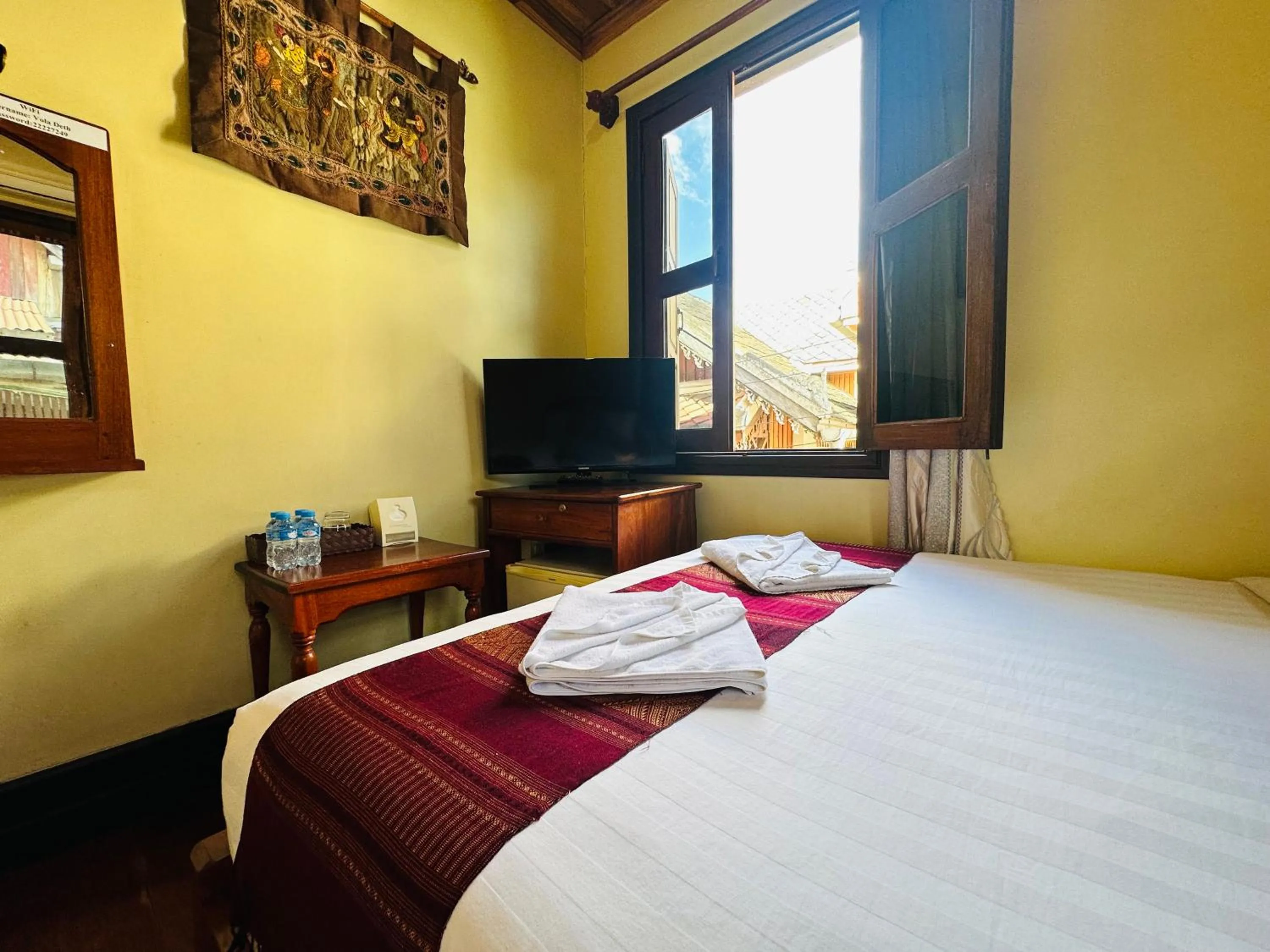 Bed in Anisa Mekong Riverside Villa