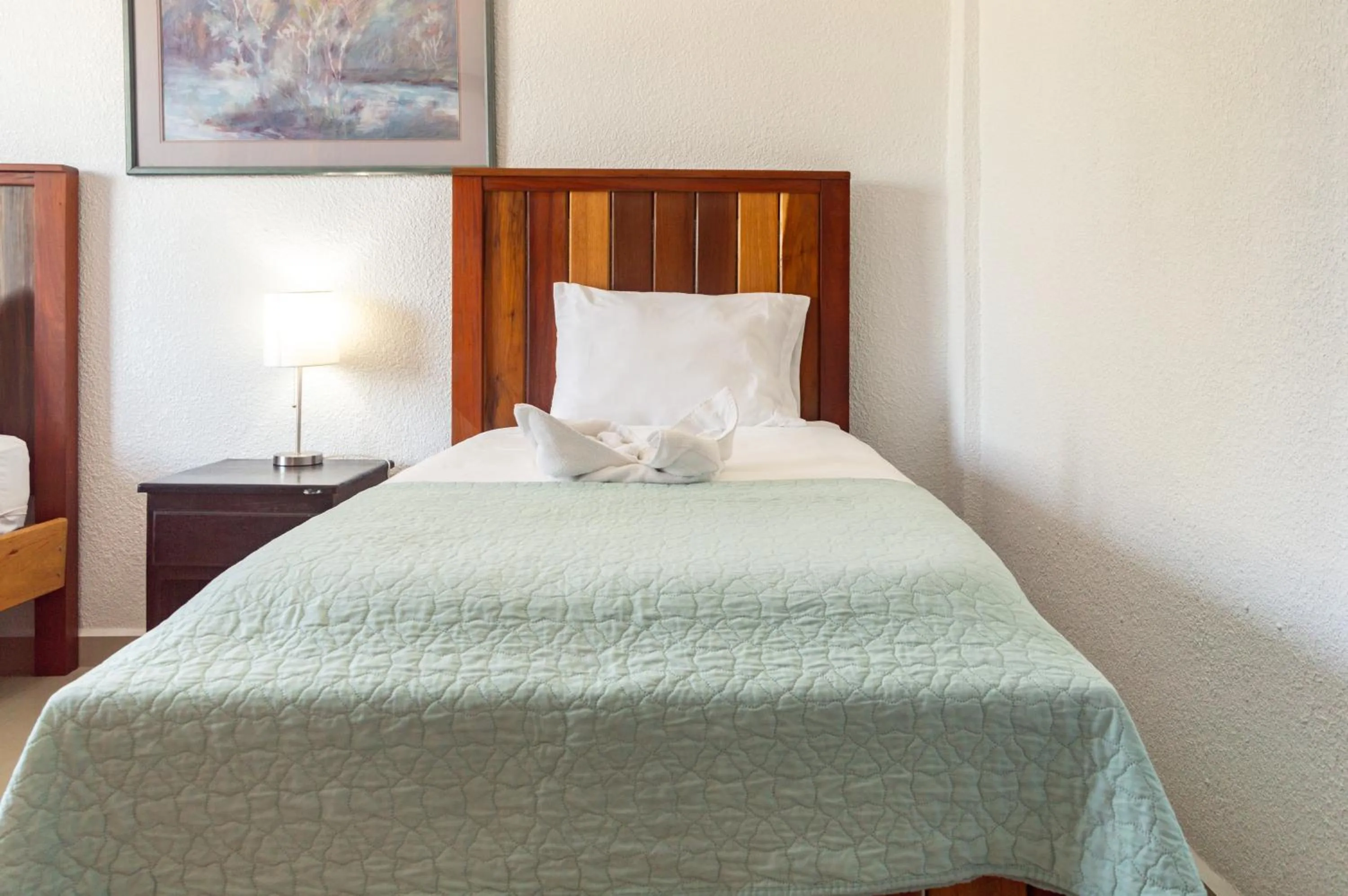 Bed in Tropical Palace Hotel