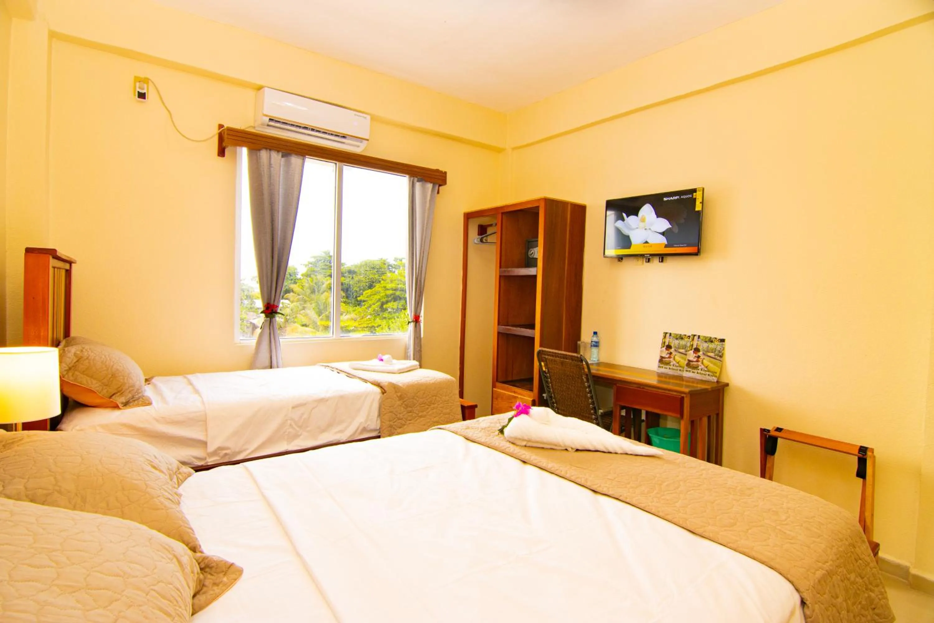 Bed in Tropical Palace Hotel