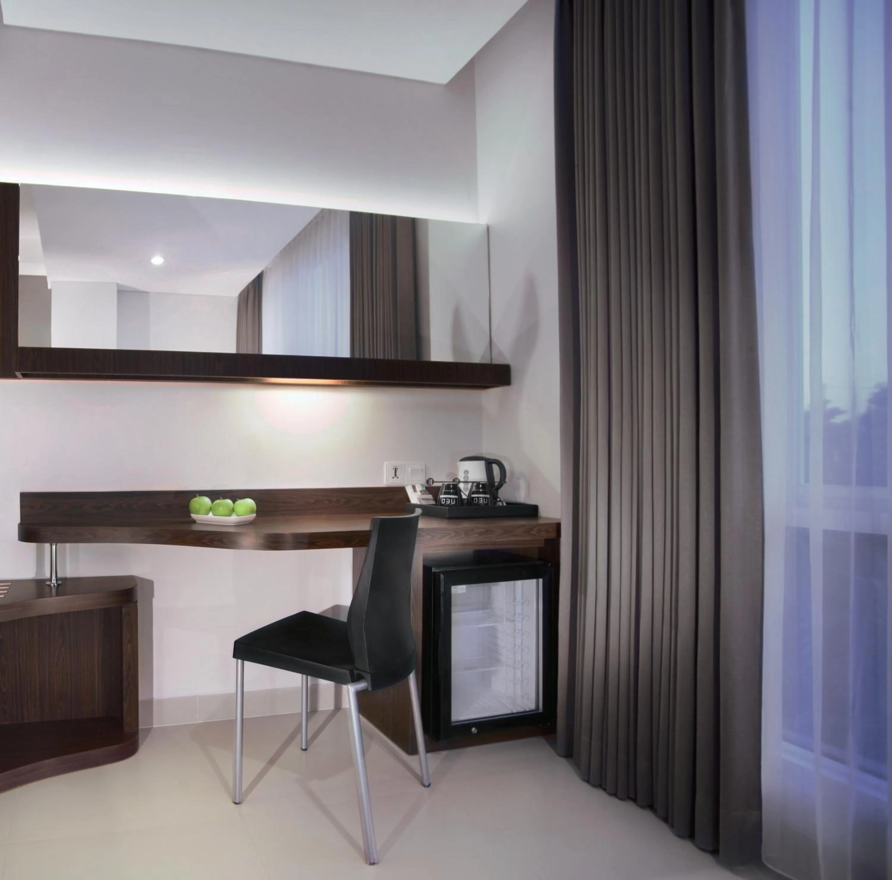 Seating area in Neo Denpasar by ASTON