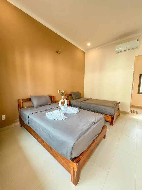Bed in ARECA MUINE HOMESTAY