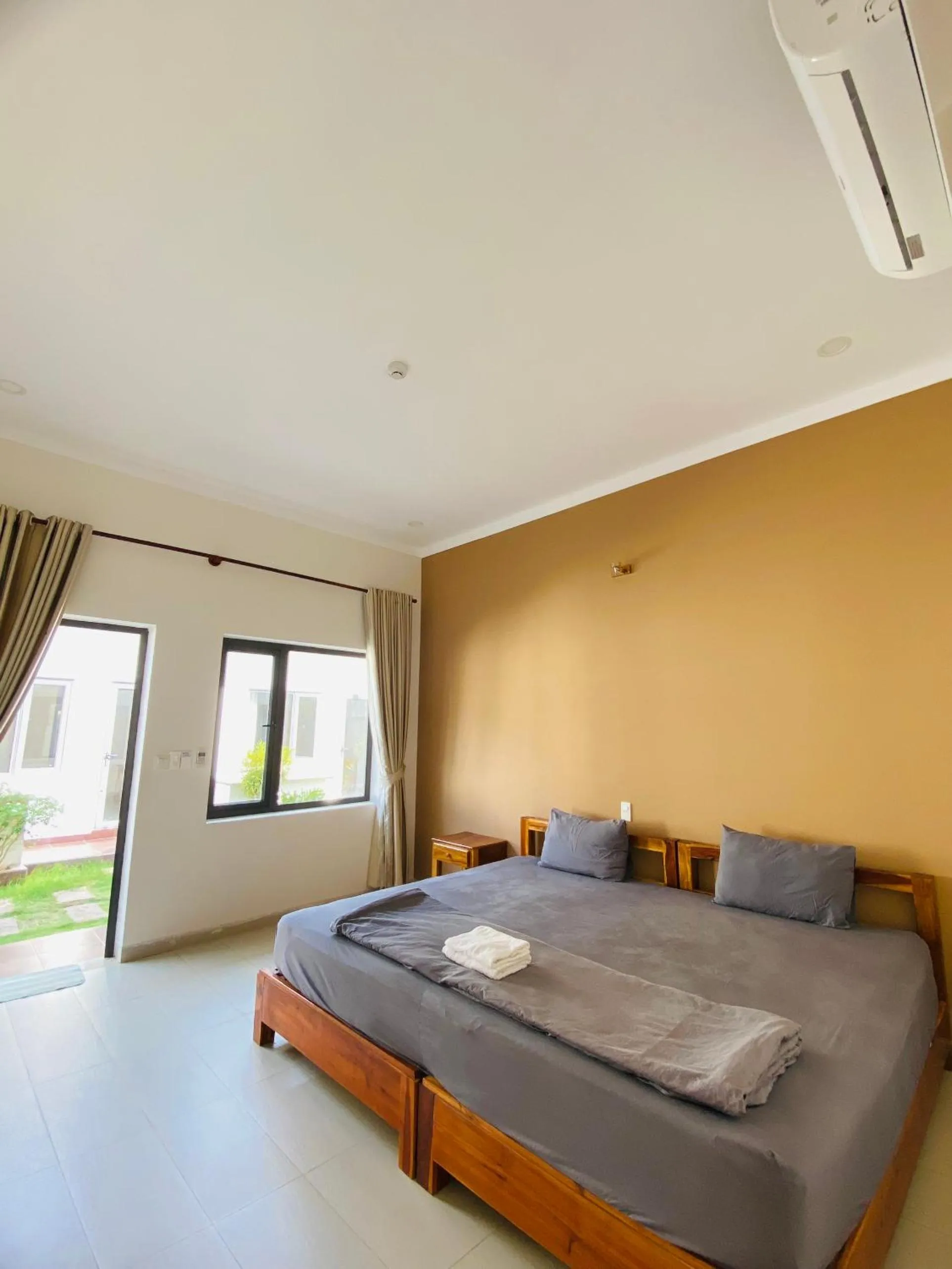 Bed in ARECA MUINE HOMESTAY