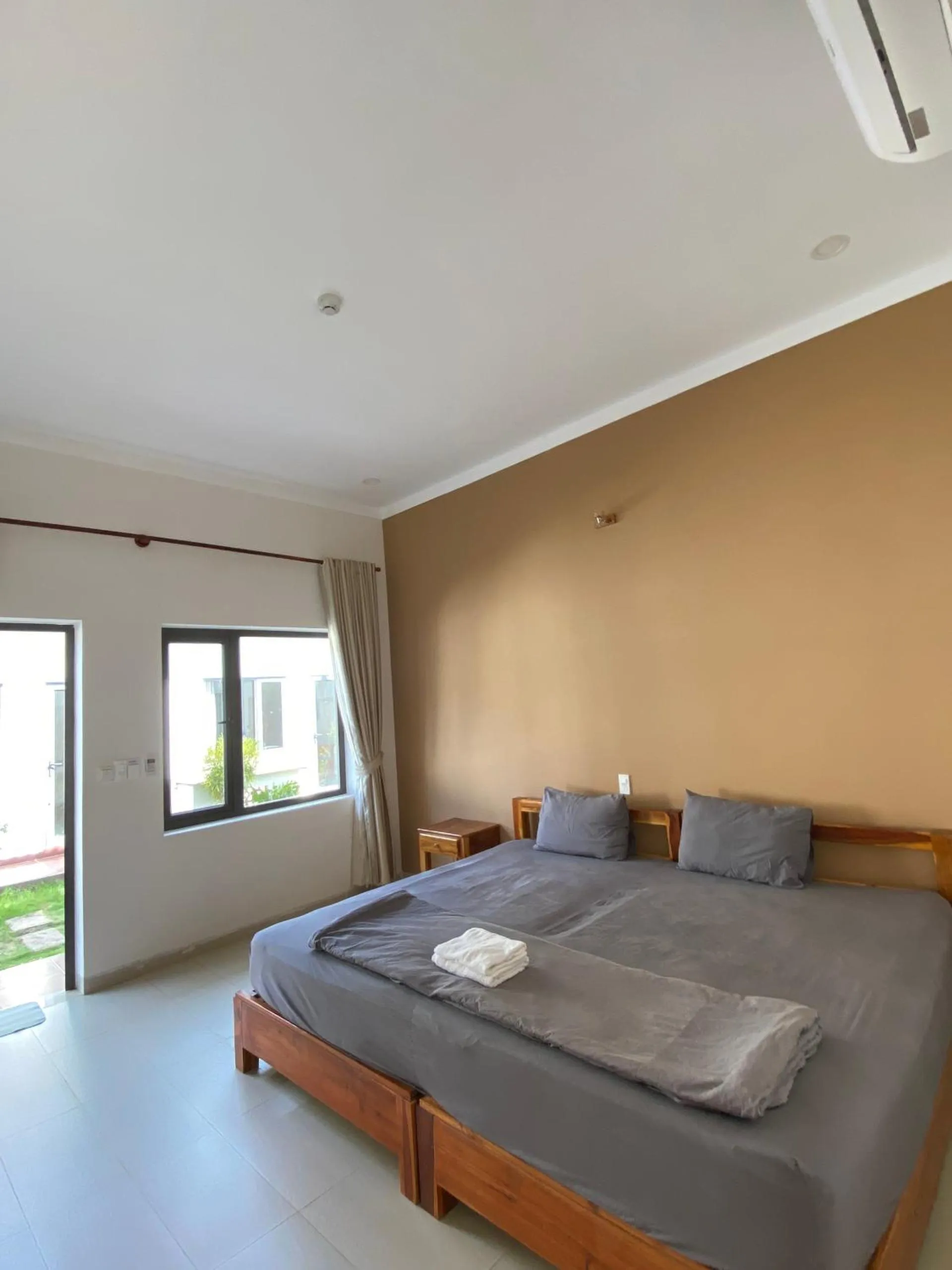 Bed in ARECA MUINE HOMESTAY