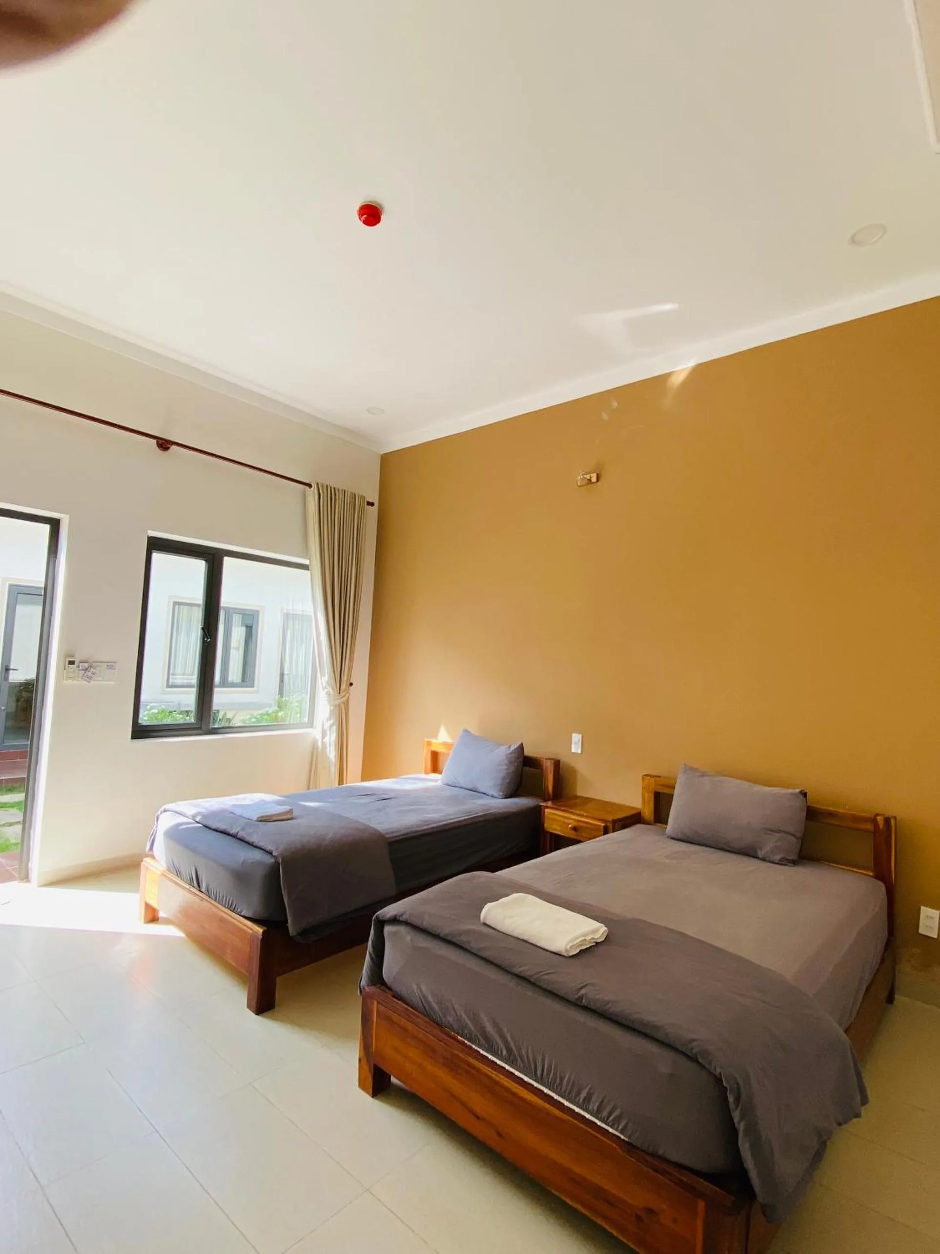 Bed in ARECA MUINE HOMESTAY