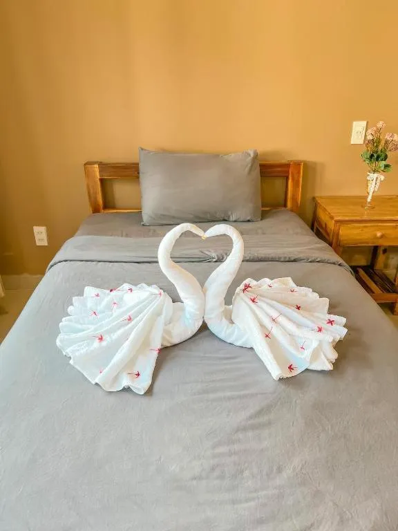 Bed in ARECA MUINE HOMESTAY