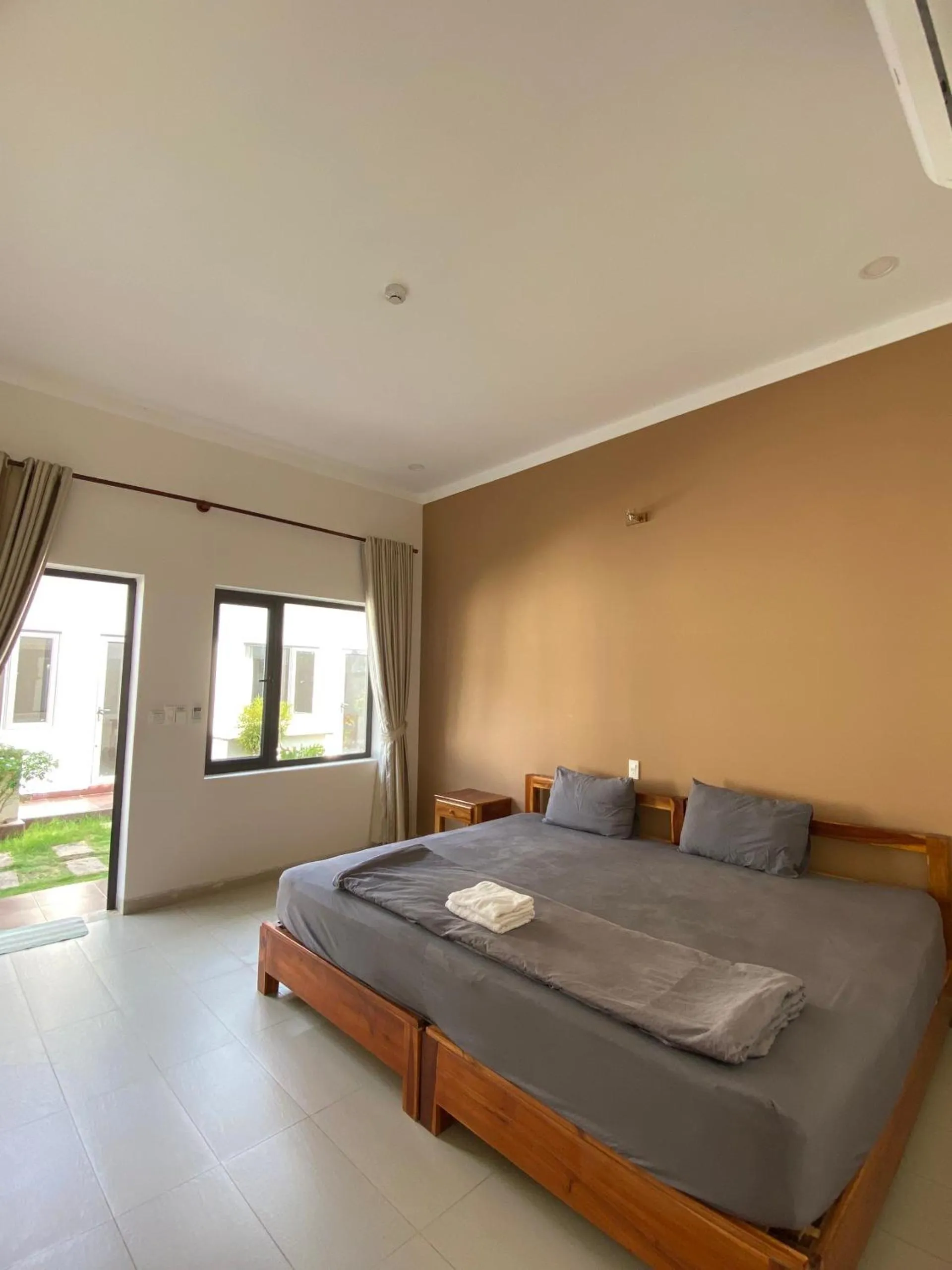 Bed in ARECA MUINE HOMESTAY