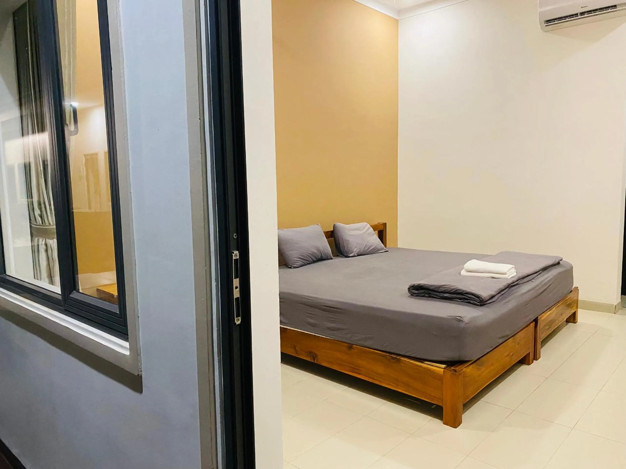 Bed in ARECA MUINE HOMESTAY