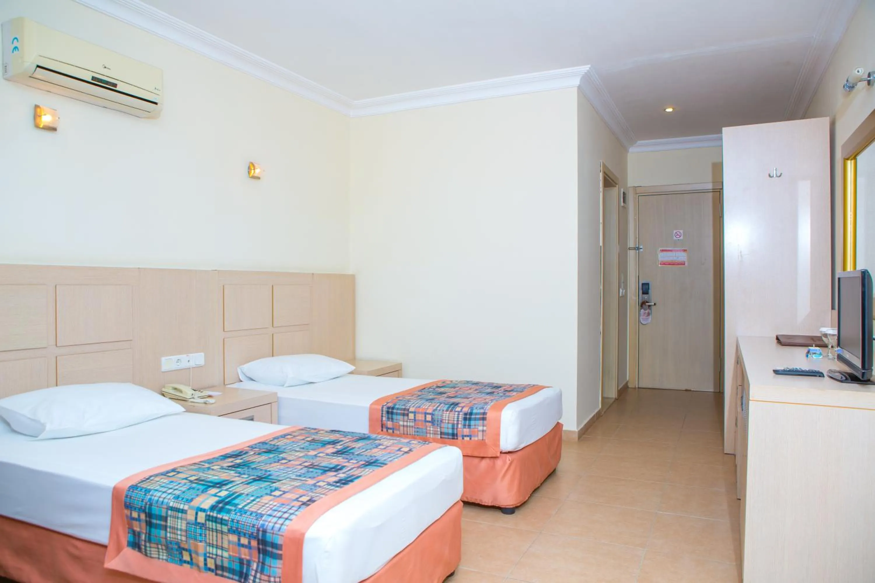 Bed in Gardenia Beach Hotel