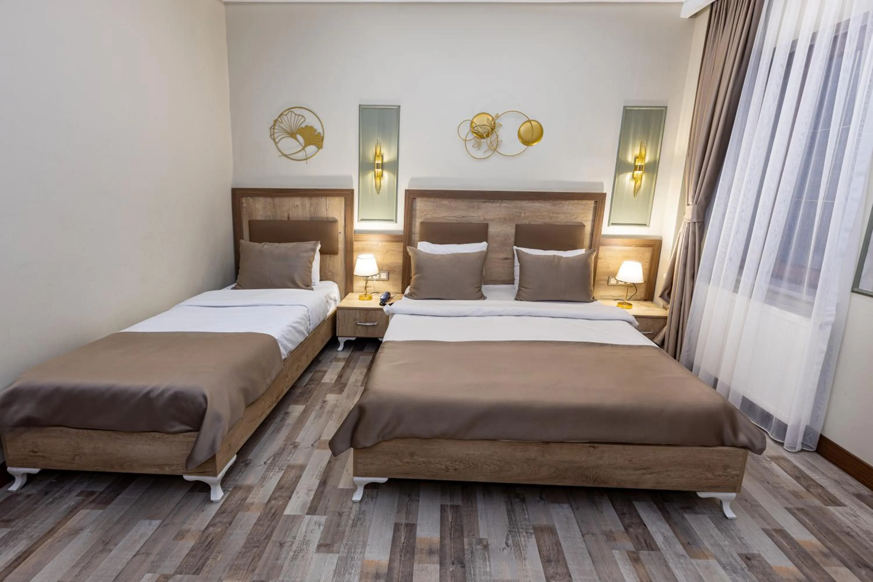 Bed in LINNGA HOTEL & SUITE