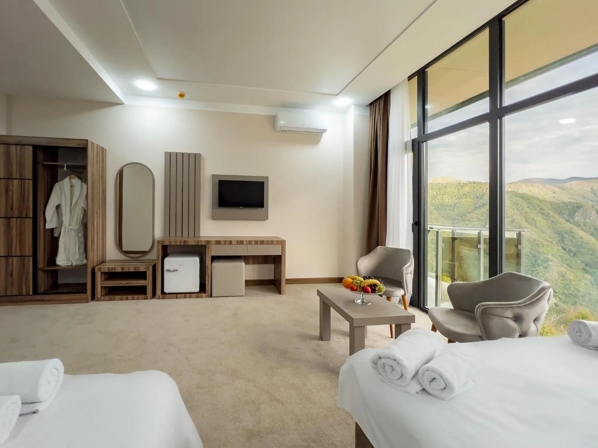 Communal lounge/ TV room, Bed in Chateau Milisi