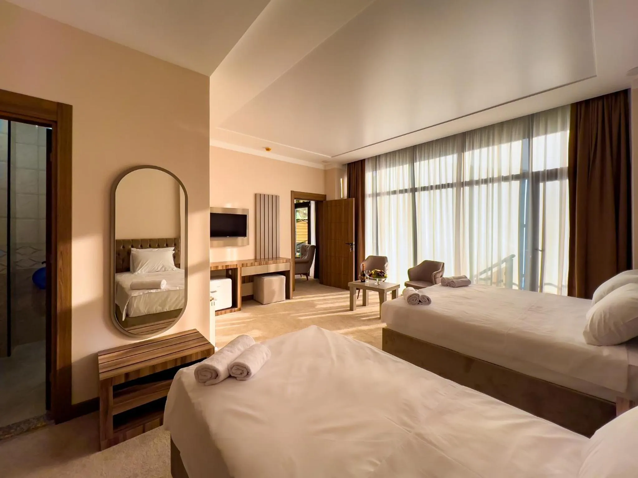 Communal lounge/ TV room, Bed in Chateau Milisi