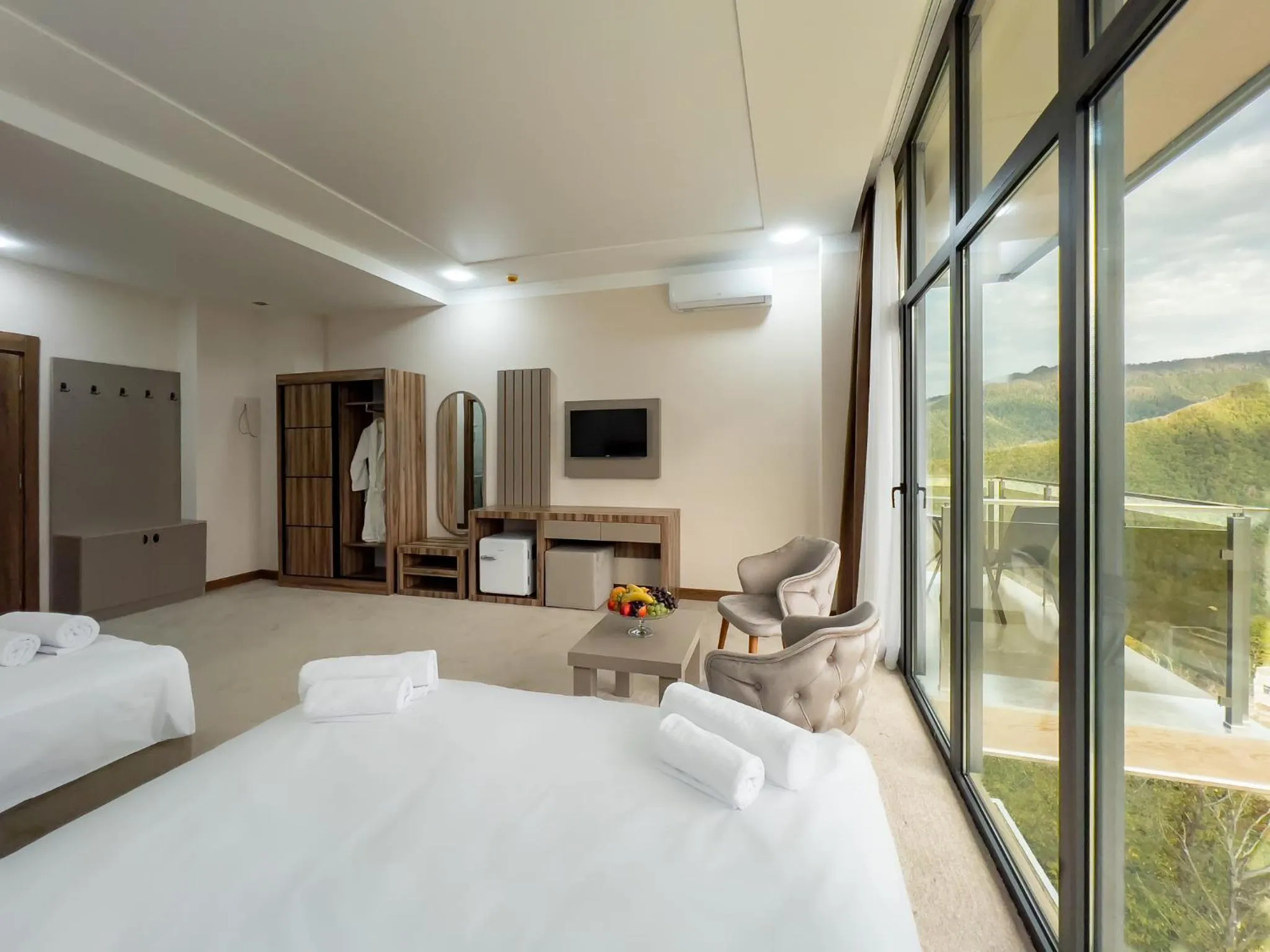 Communal lounge/ TV room, Bed in Chateau Milisi