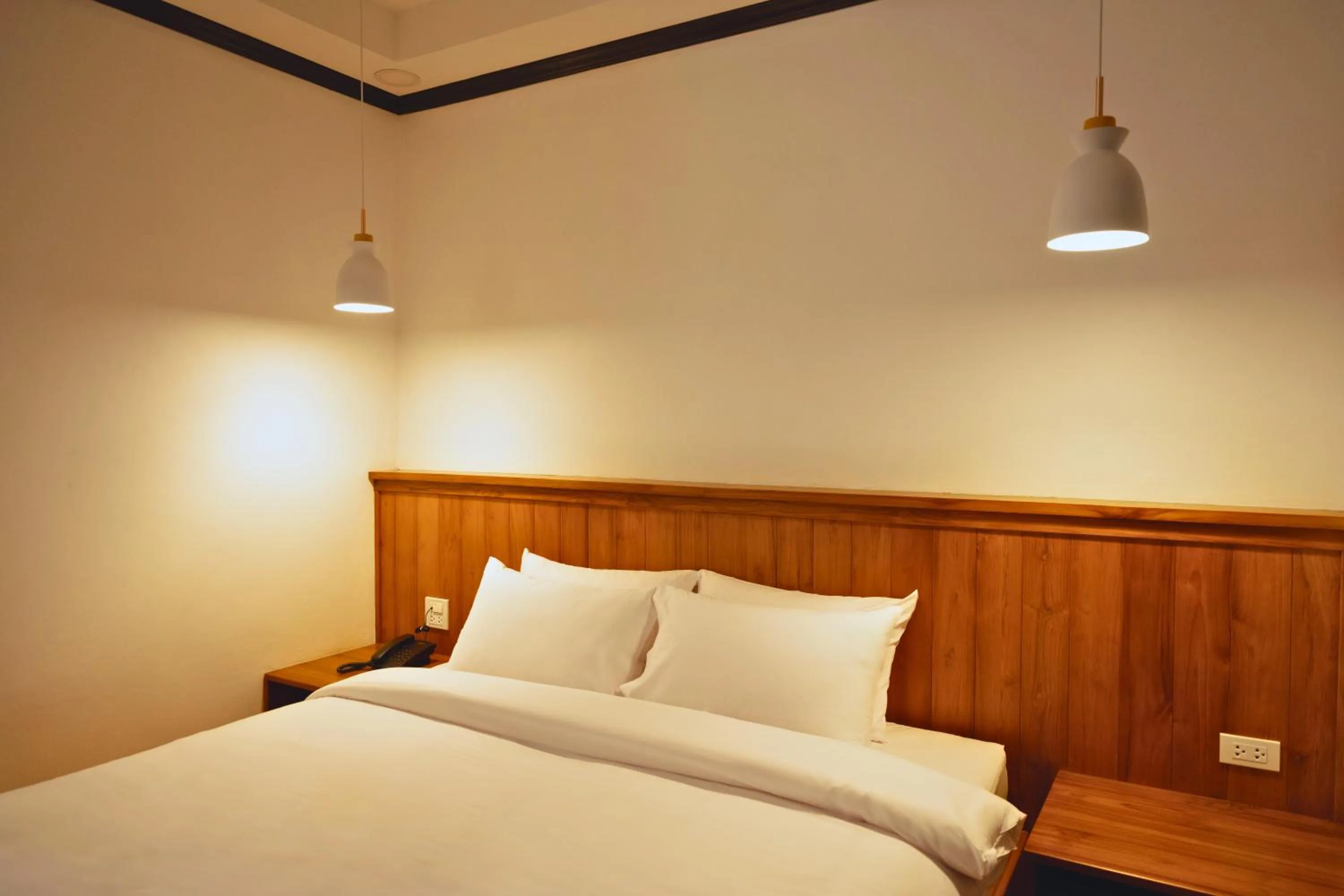 Bed in Oudomsin VangVieng Hotel