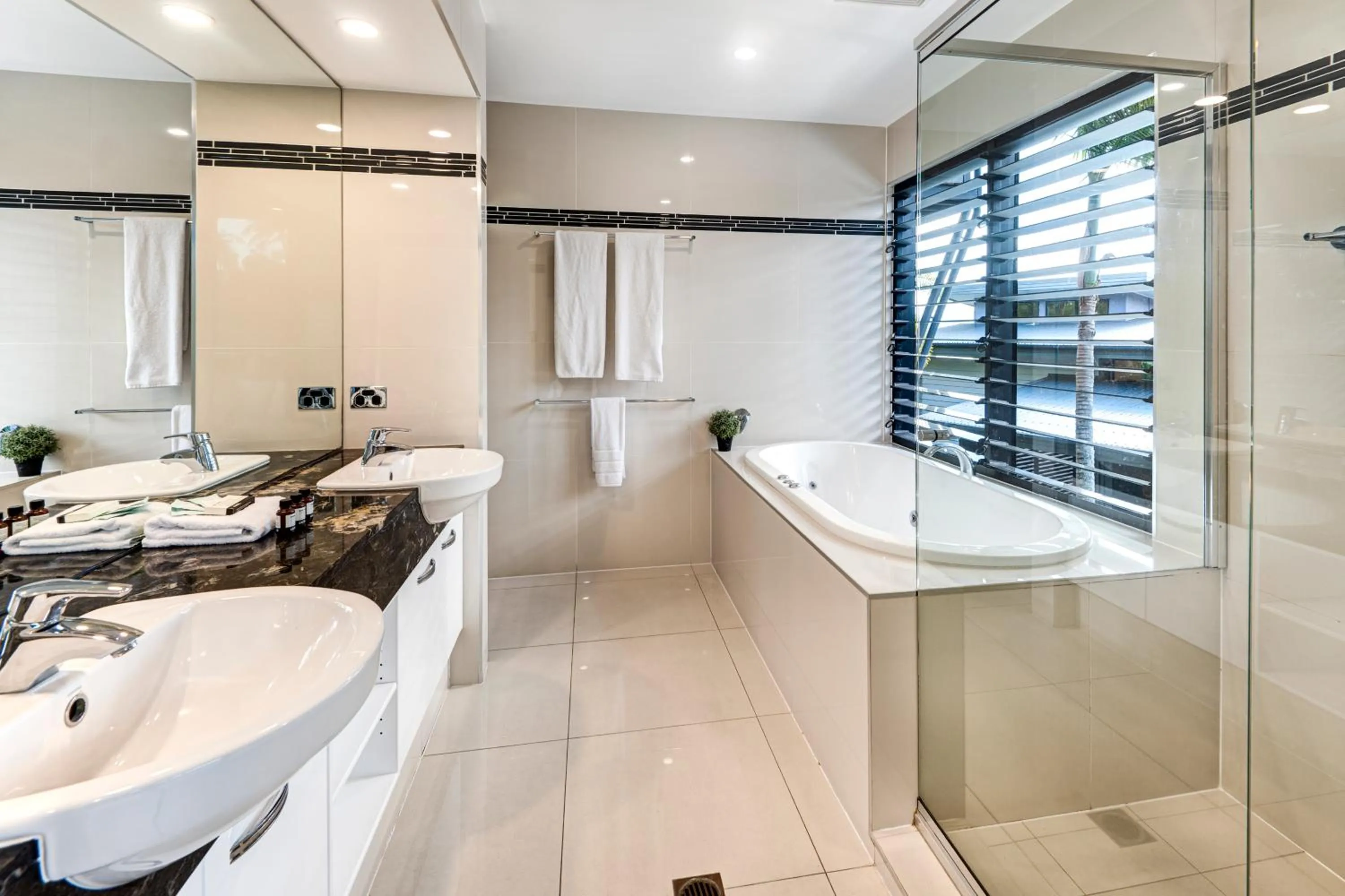Bathroom in Pinnacle Apartments on Hamilton Island by HIHA