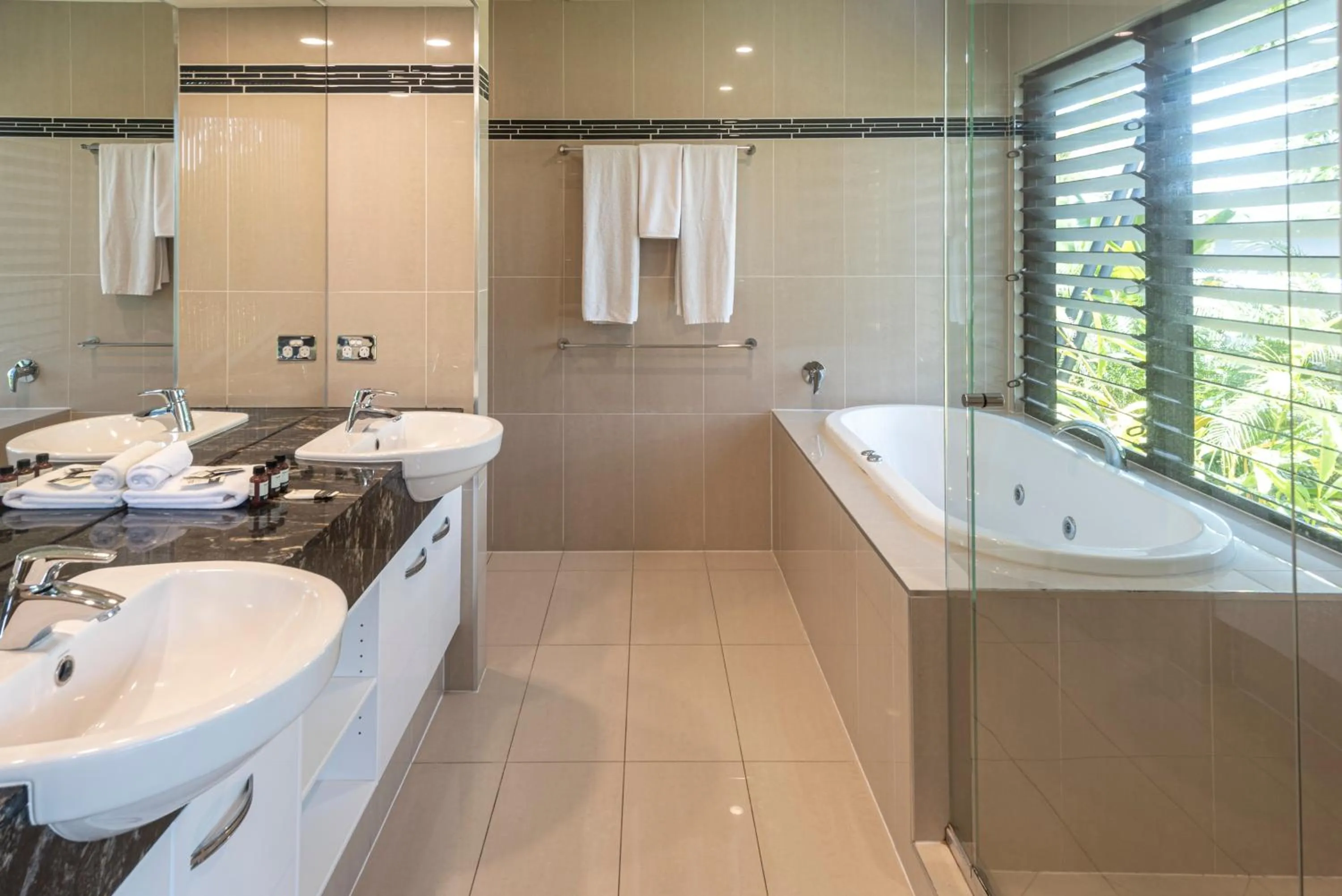 Bathroom in Pinnacle Apartments on Hamilton Island by HIHA