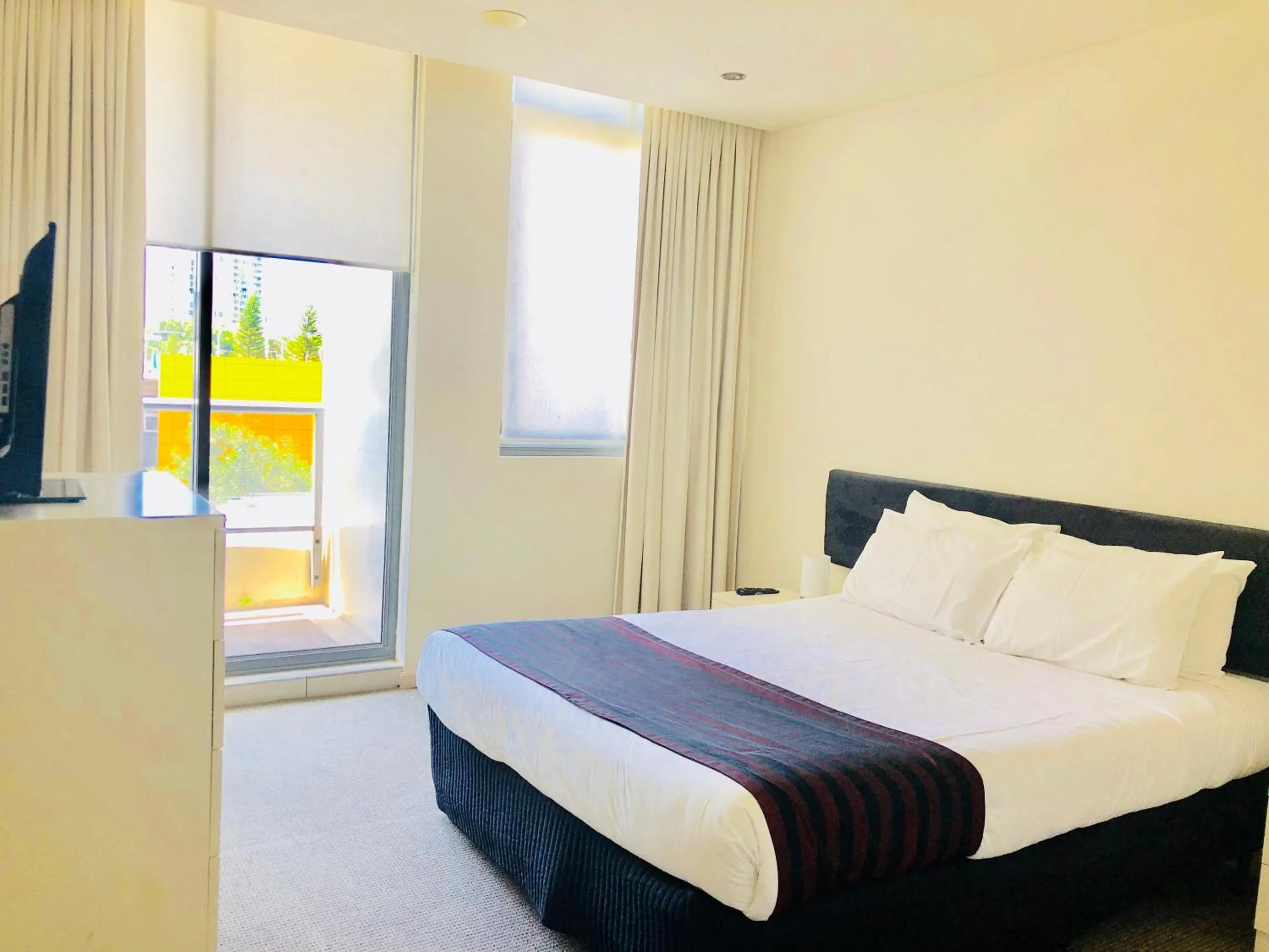 Bed in Solaire Apartments