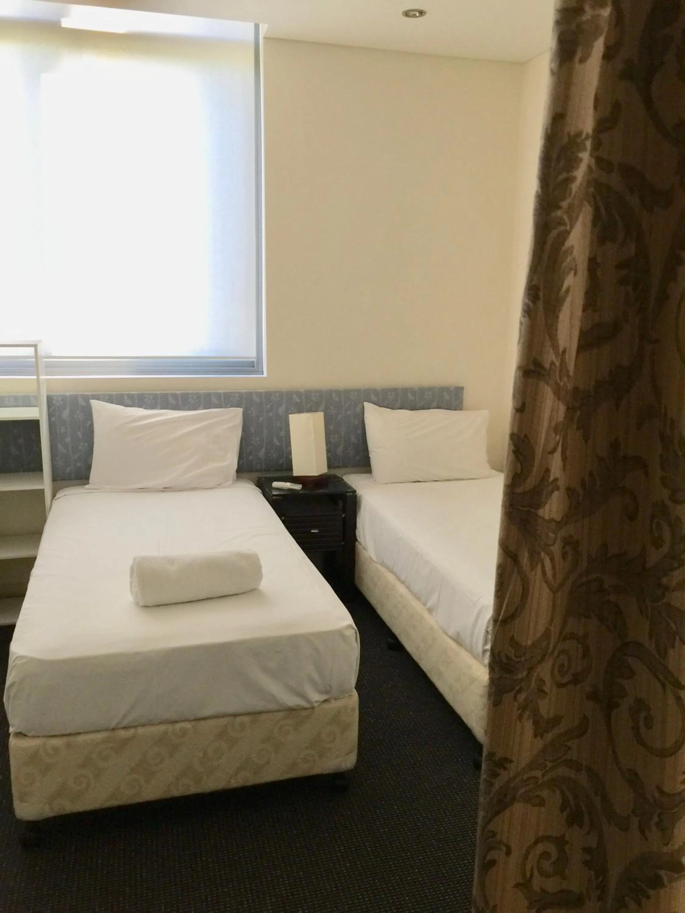 Bed in Solaire Apartments