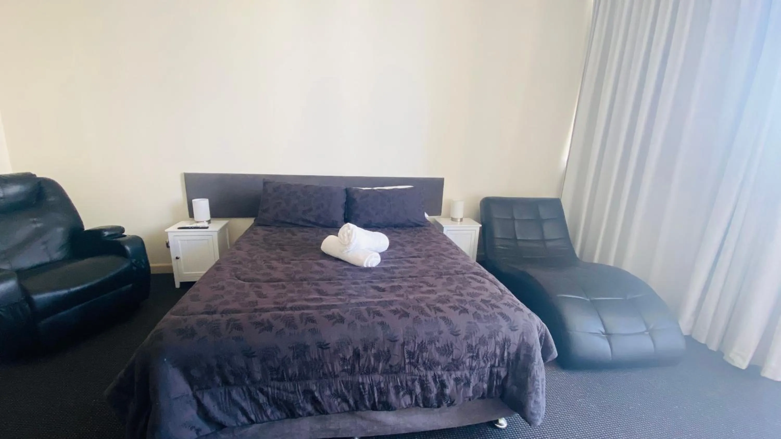 Bed in Solaire Apartments