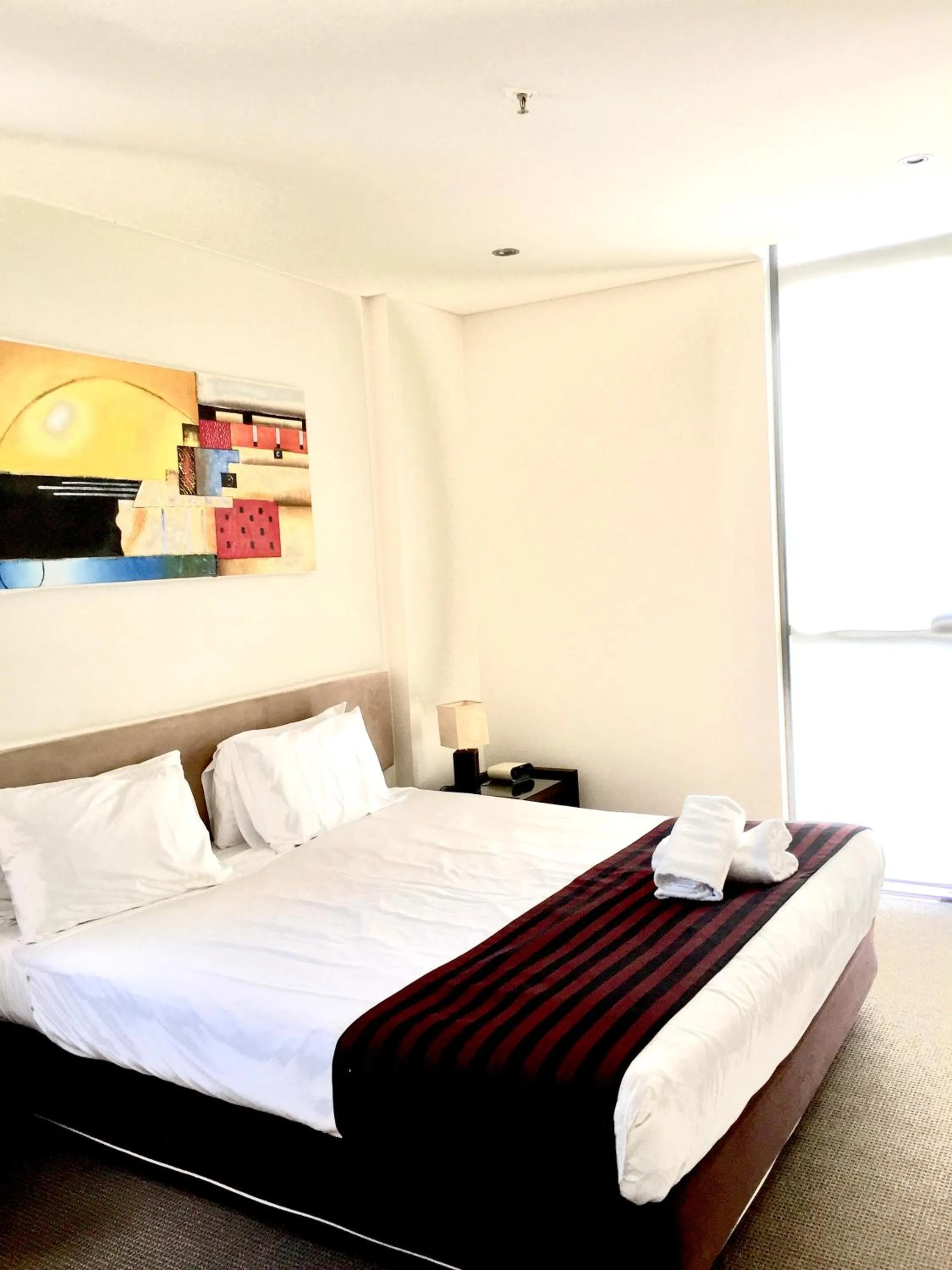 Bed in Solaire Apartments