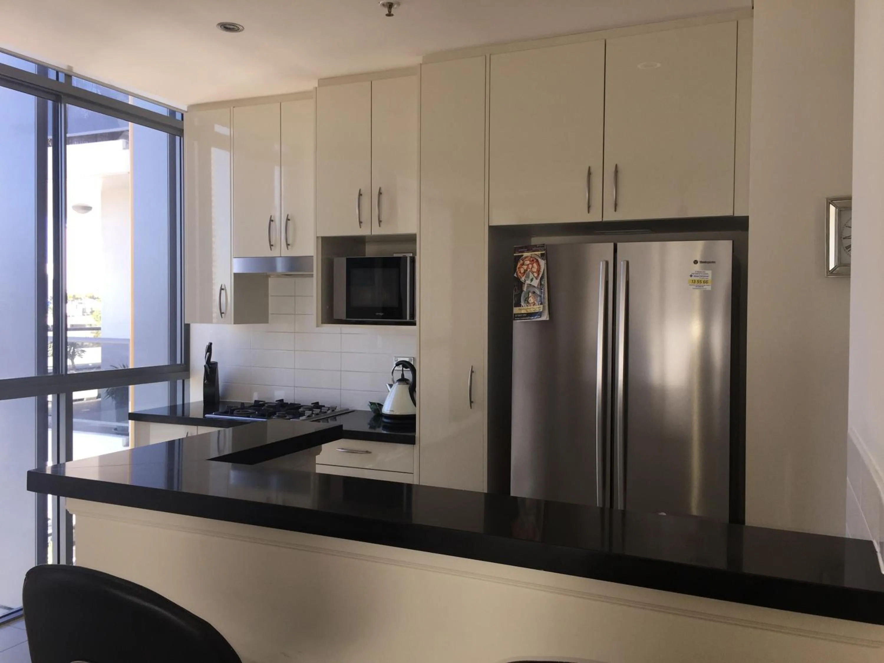Kitchen or kitchenette in Solaire Apartments