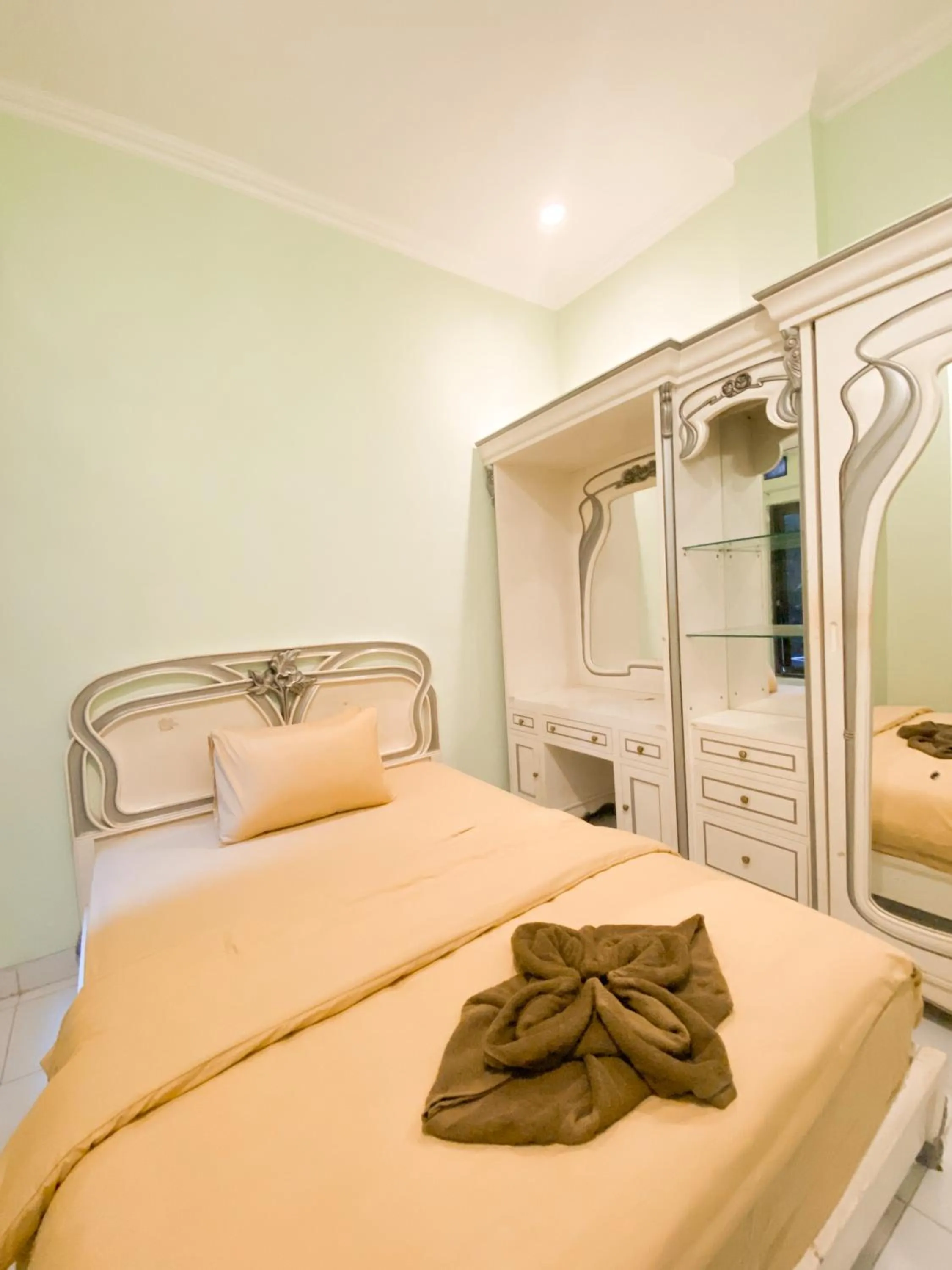 Bed in Homestay Kamar Tamu Gedongkiwo