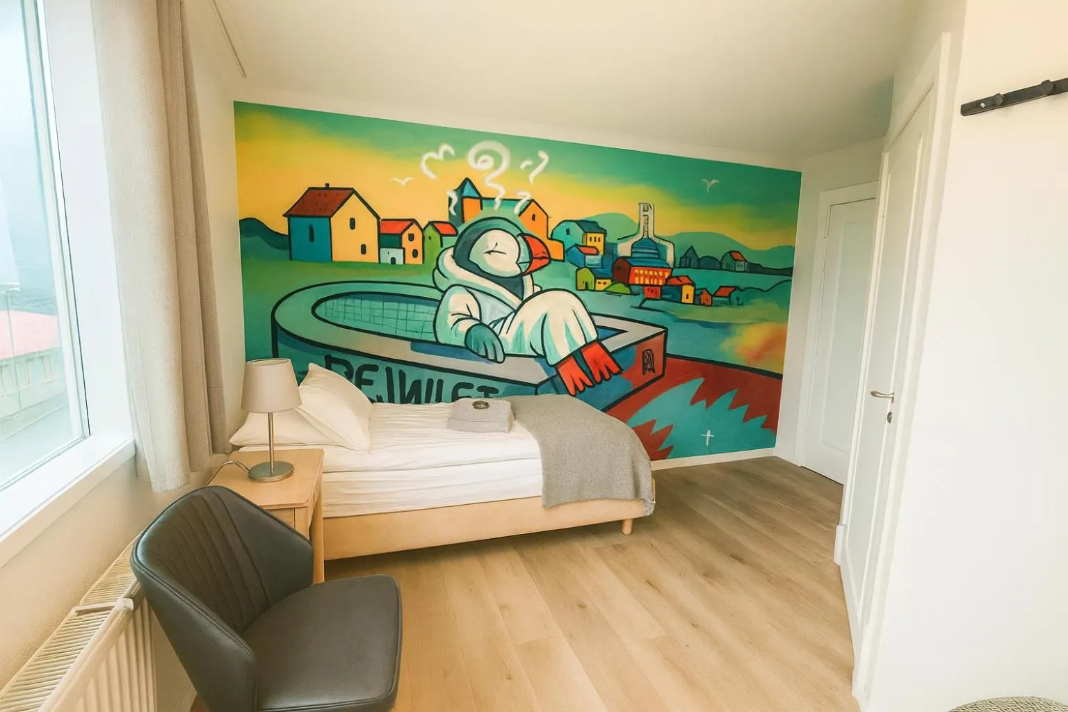 Seating area, Bed in The Stykkishólmur Inn by Ourhotels