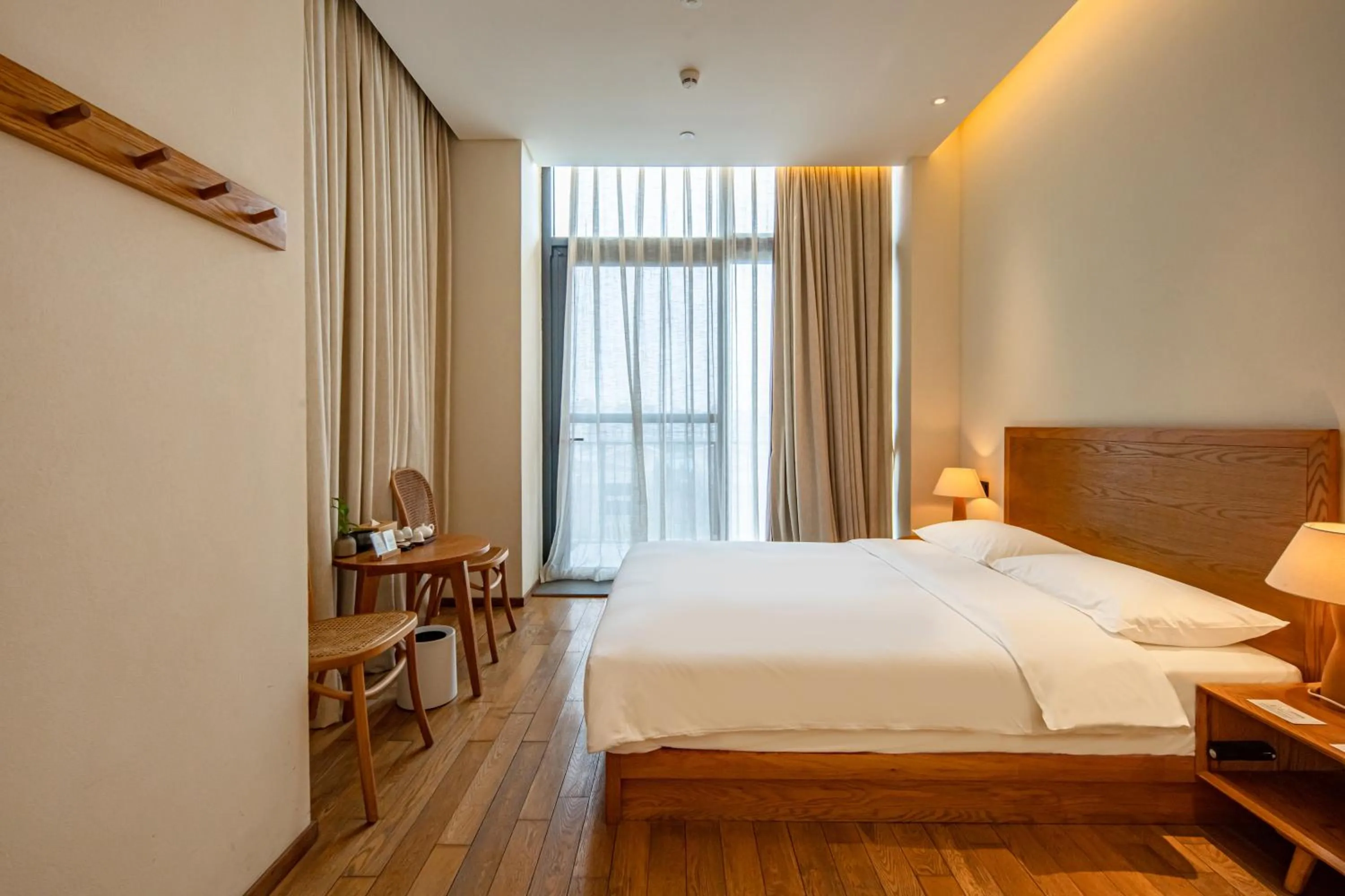 Bed in Taihua Wutong Hotel