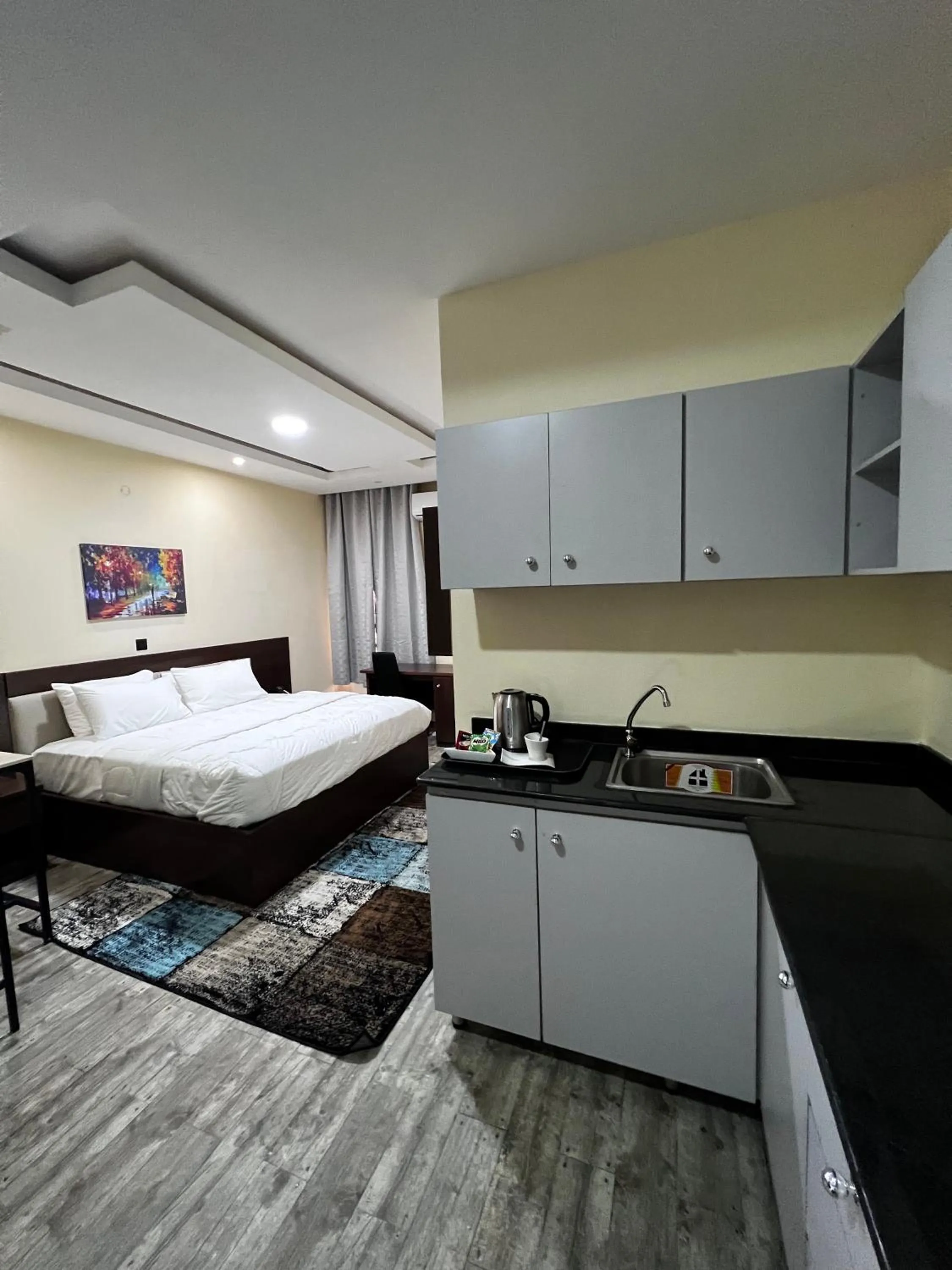 Bed in Fragrance Apartments and Suites