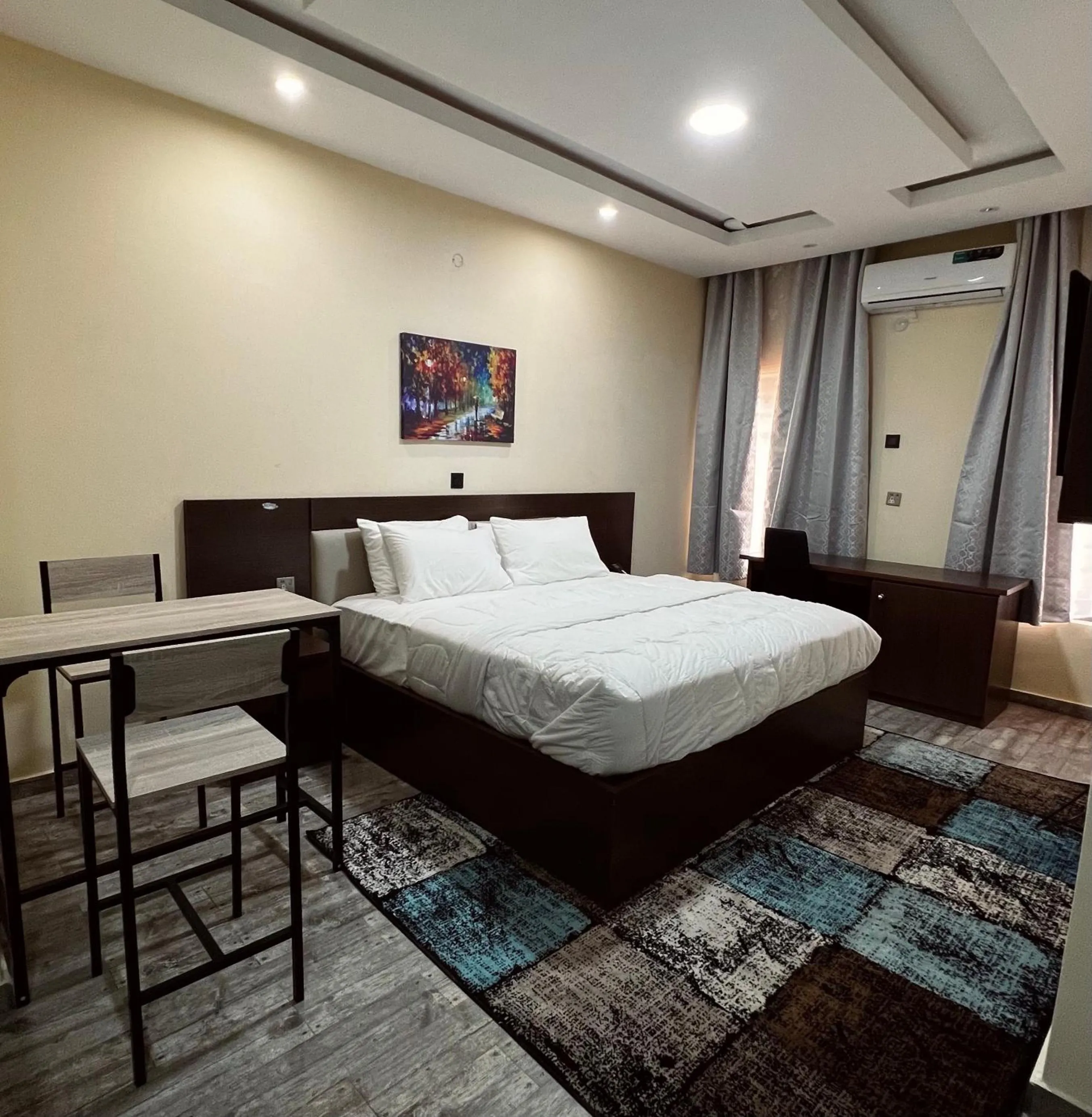 Bed in Fragrance Apartments and Suites