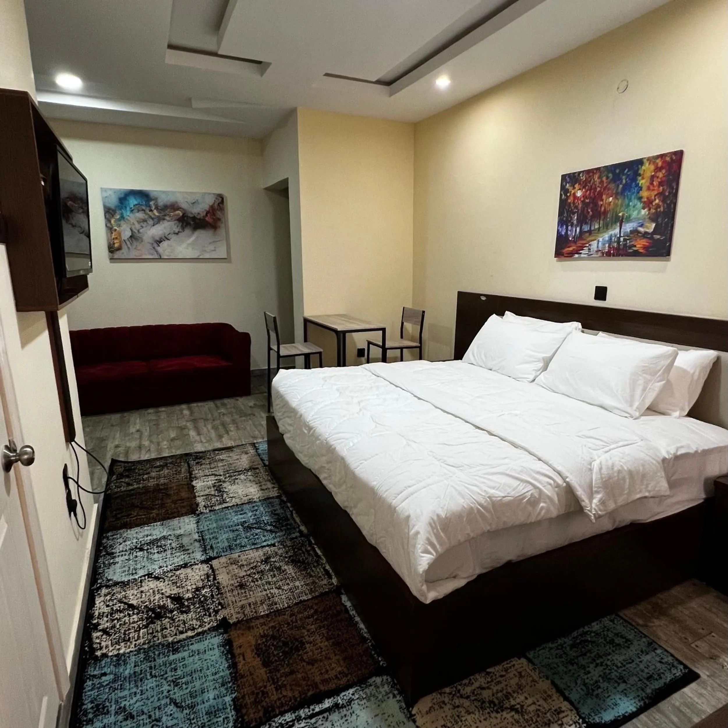 Bed in Fragrance Apartments and Suites