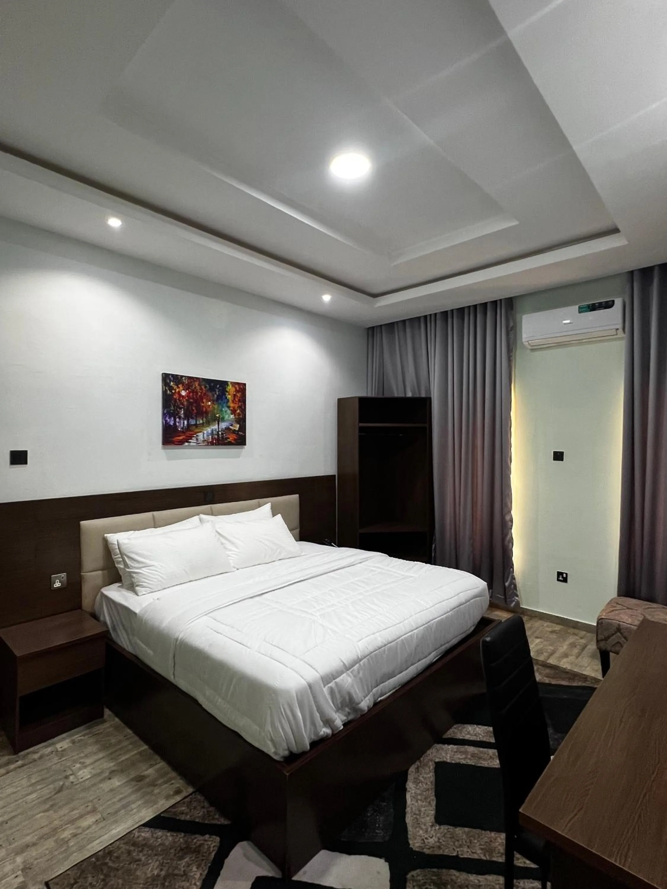 Bed in Fragrance Apartments and Suites