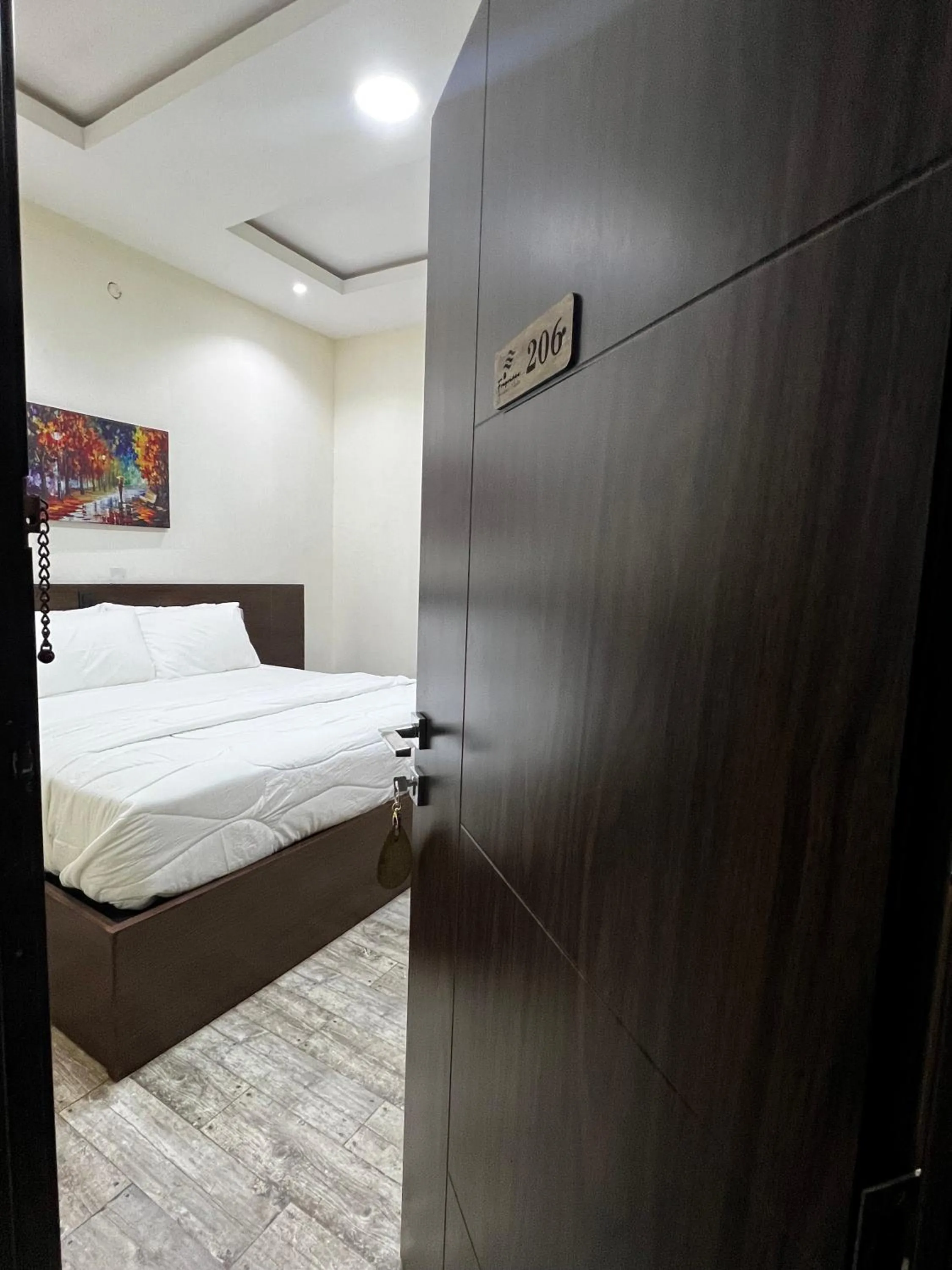 Bed in Fragrance Apartments and Suites