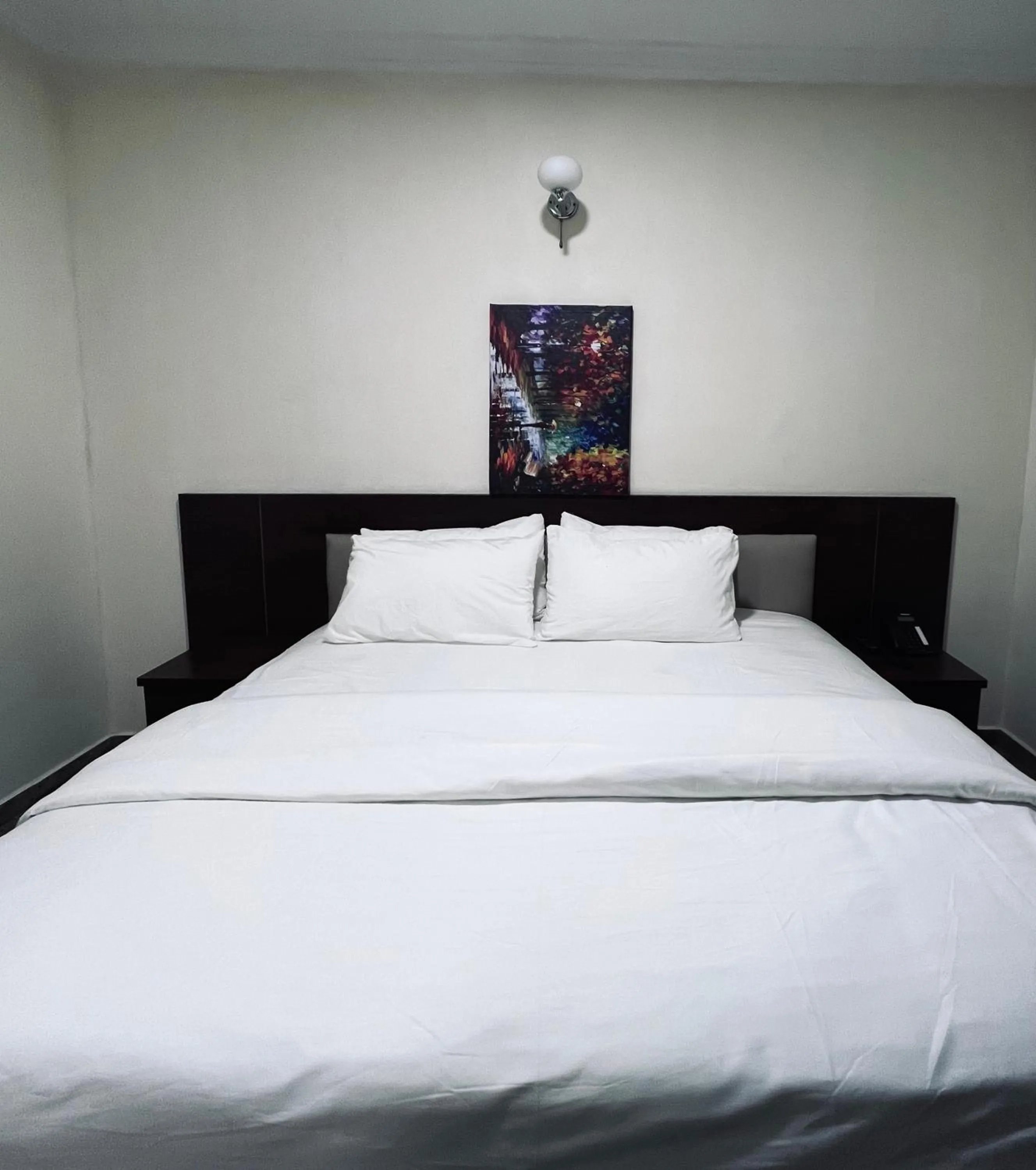 Bed in Fragrance Apartments and Suites