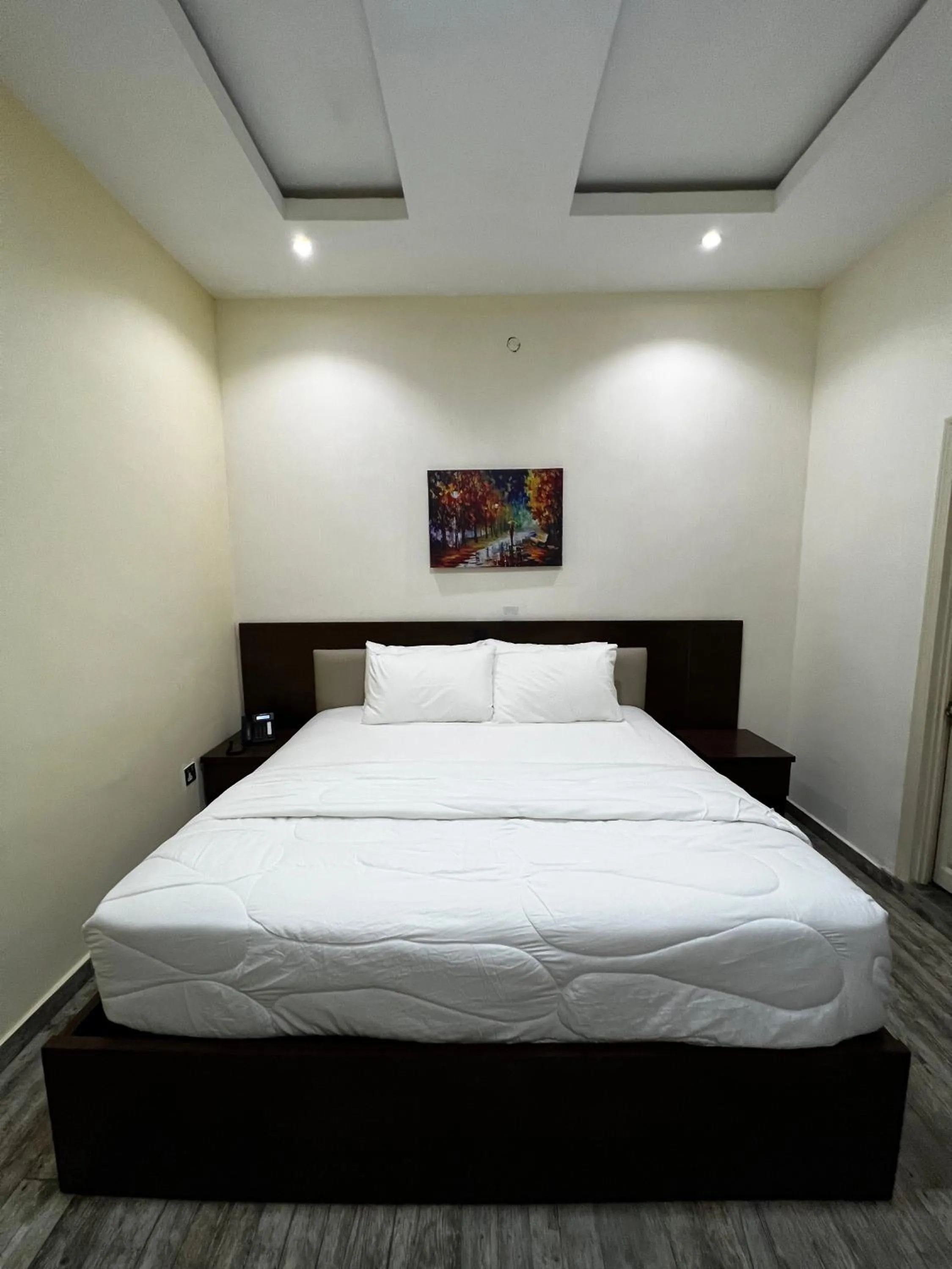 Bed in Fragrance Apartments and Suites