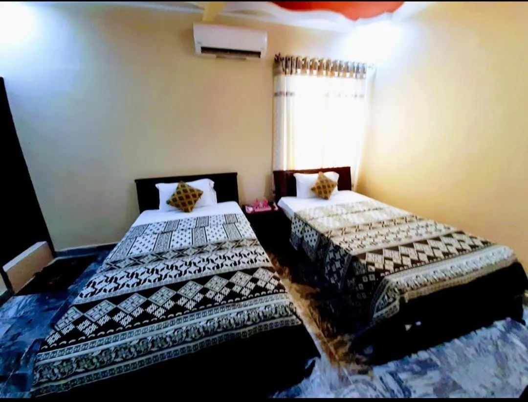 Bed in Galaxy Inn Guest House