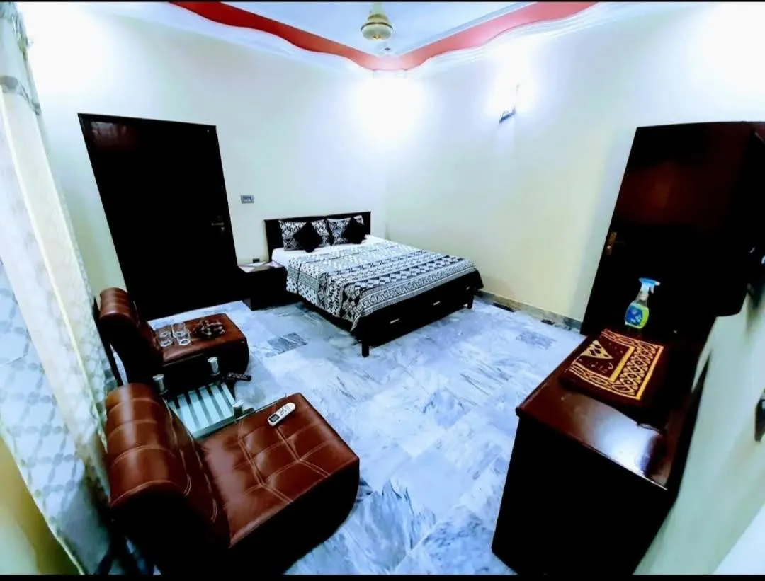 Seating area, Bed in Galaxy Inn Guest House