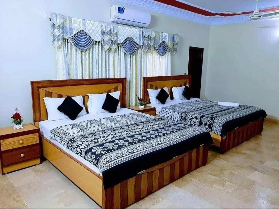 Bed in Galaxy Inn Guest House