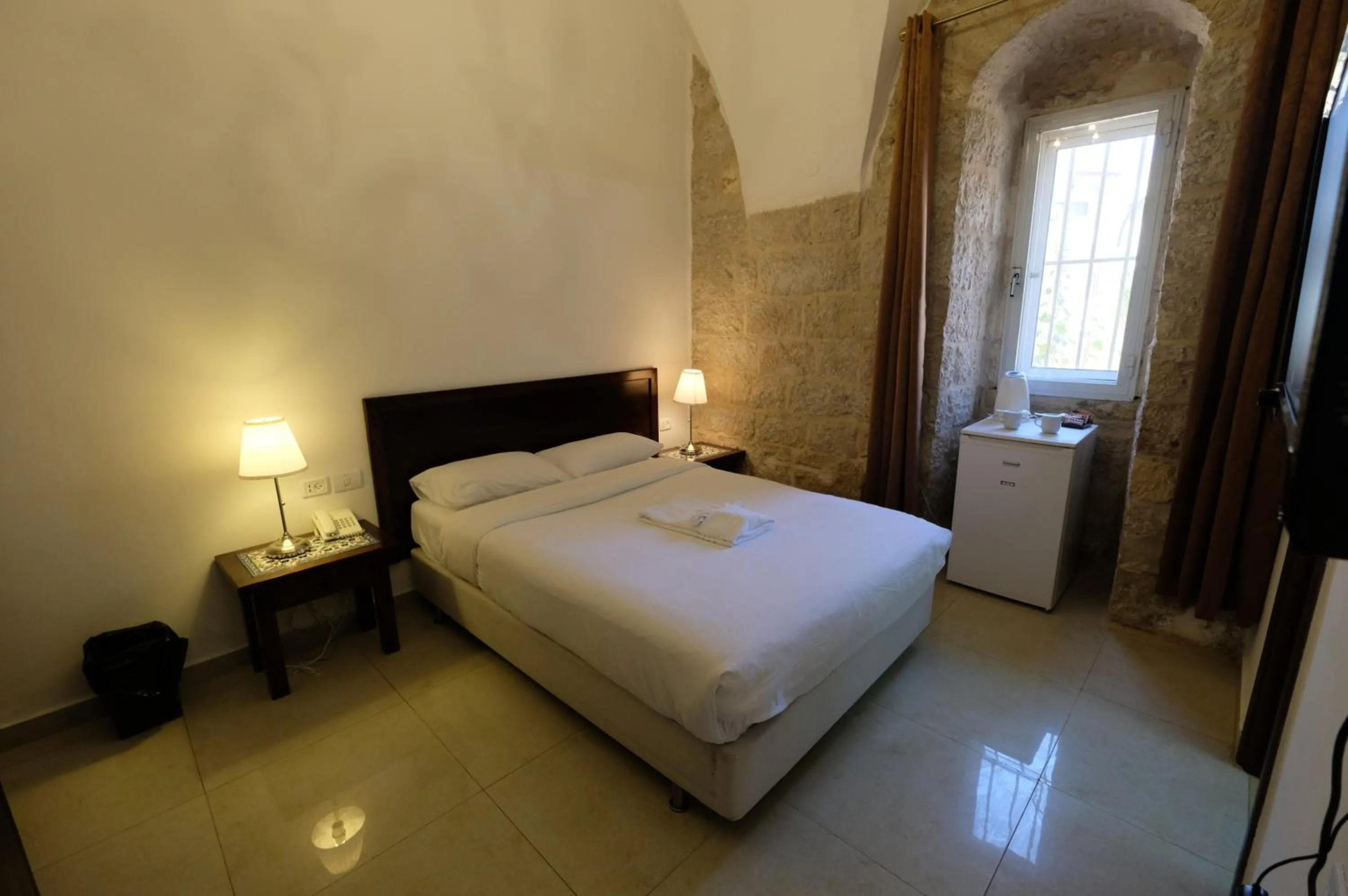 Bedroom, Bed in St. George’s Cathedral Pilgrim Guesthouse – Jerusalem