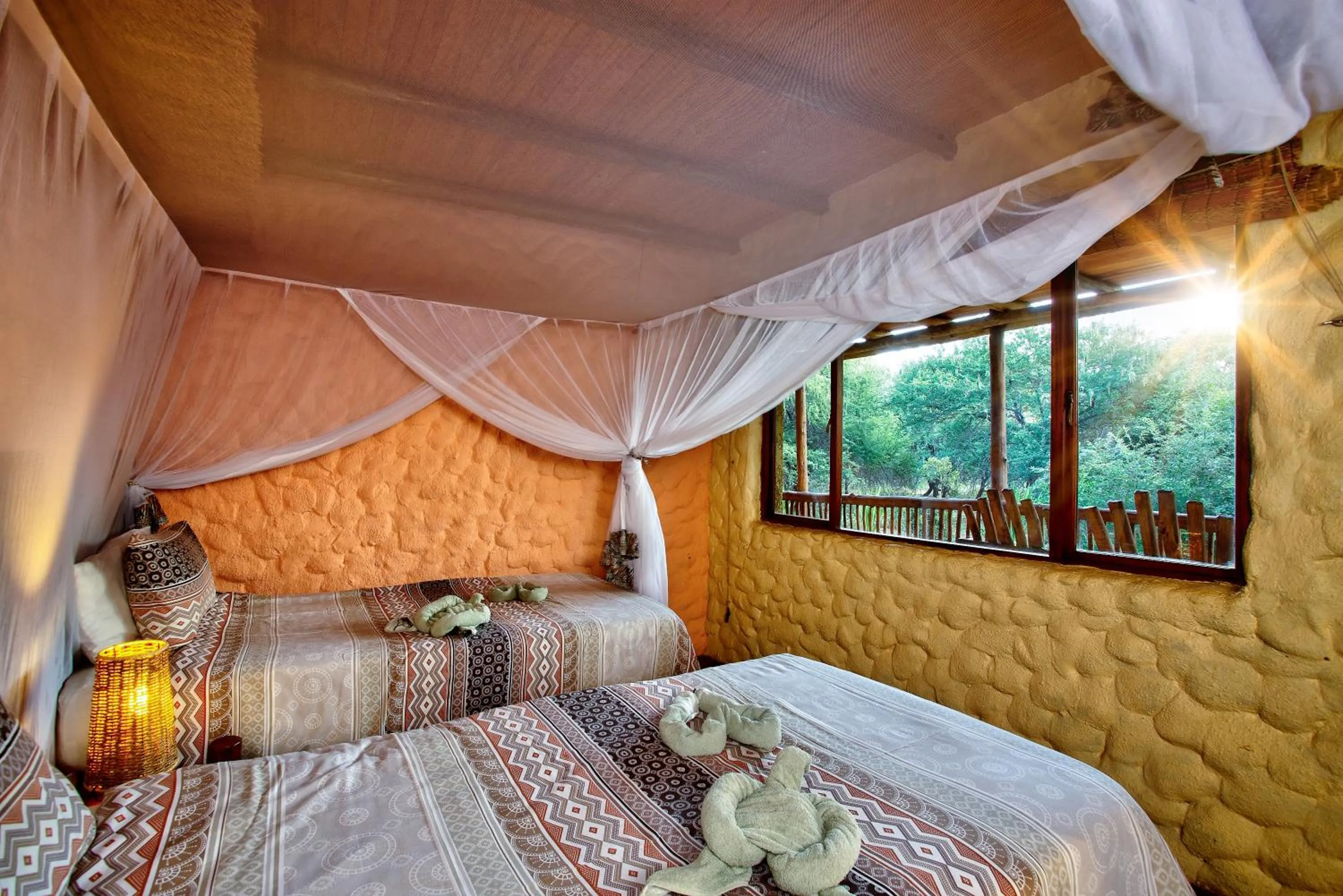 Bed in Kubu Safari Lodge