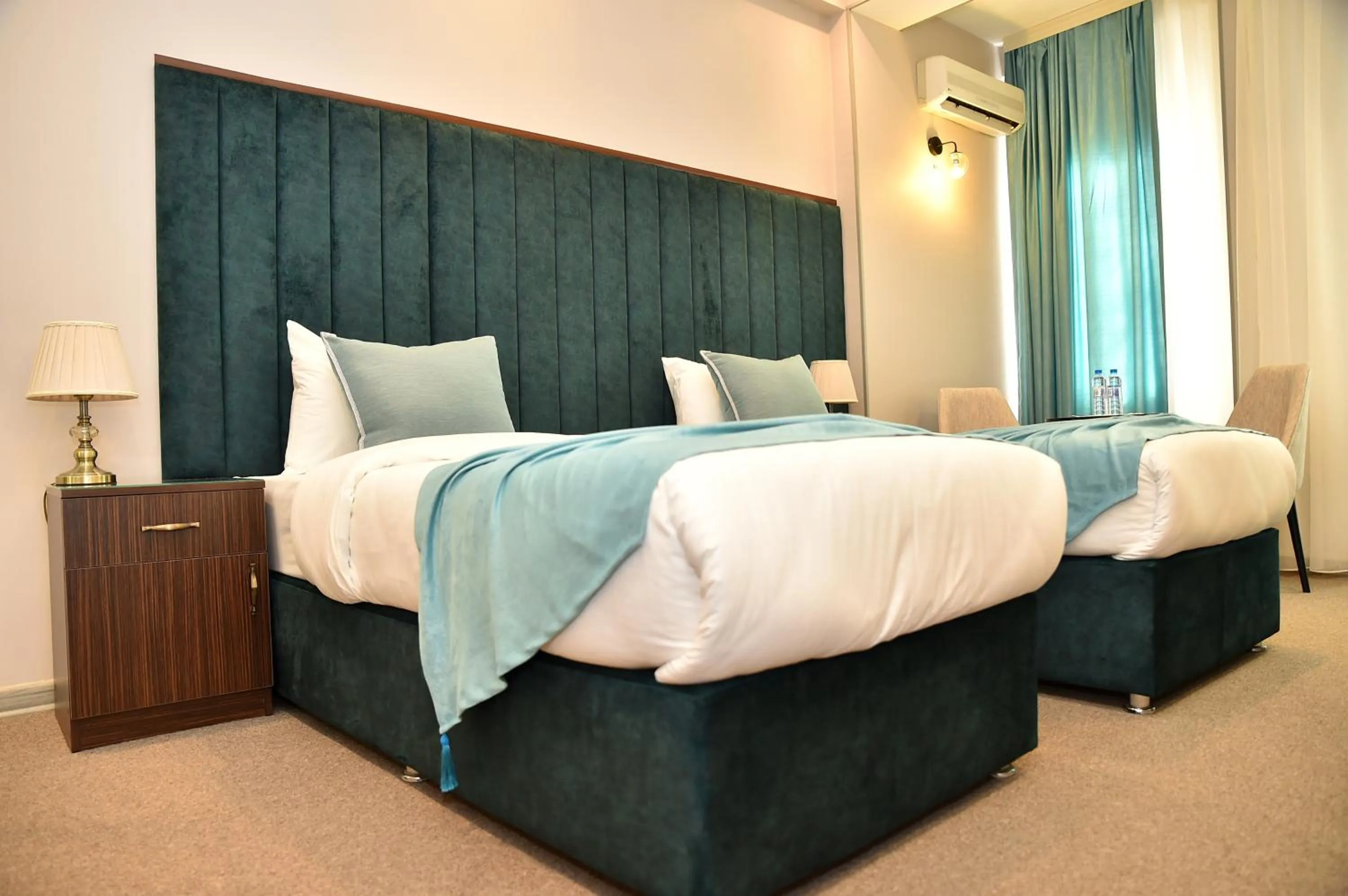 Bed in Karat Inn Boutique Hotel