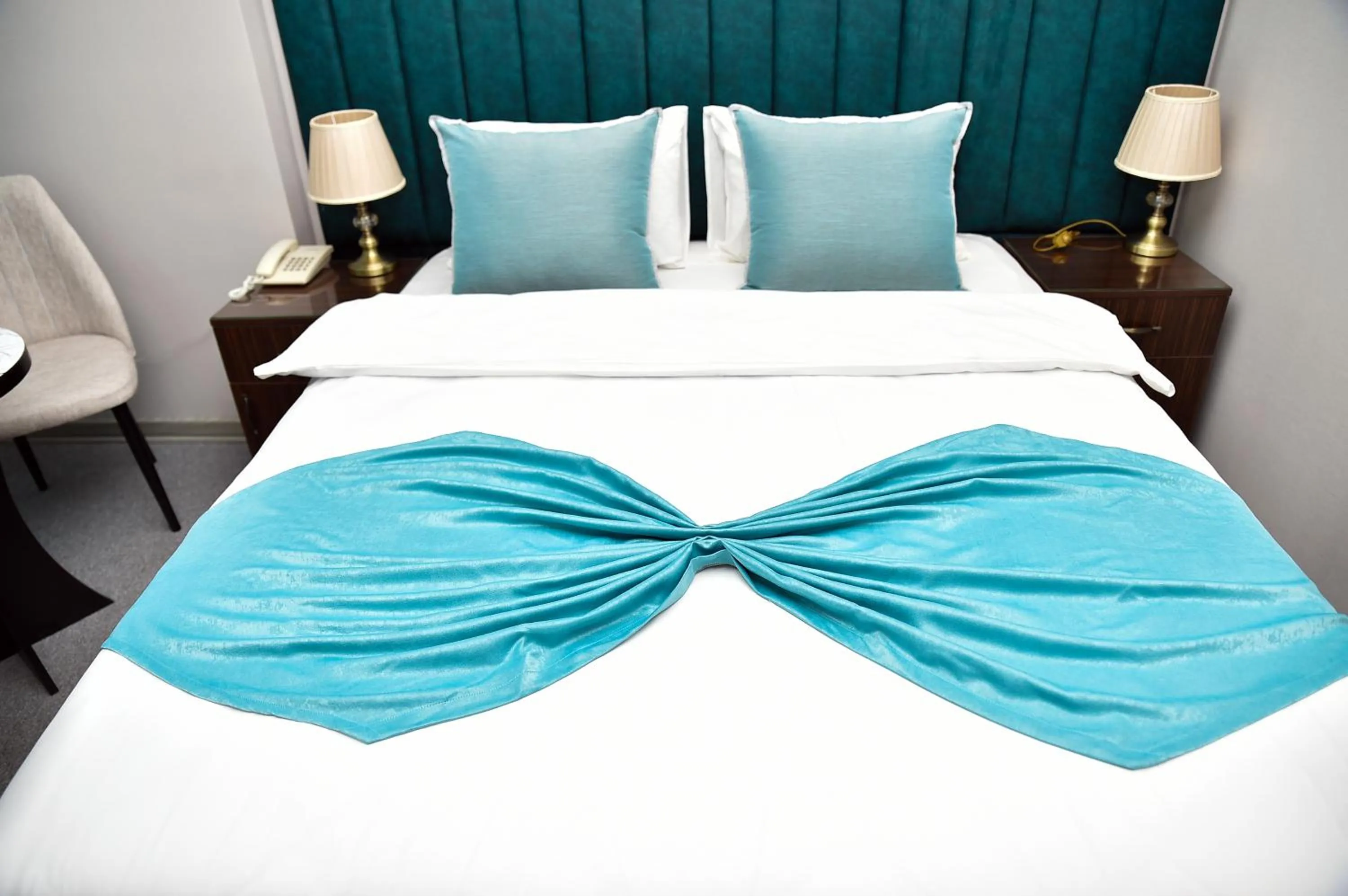Bed in Karat Inn Boutique Hotel