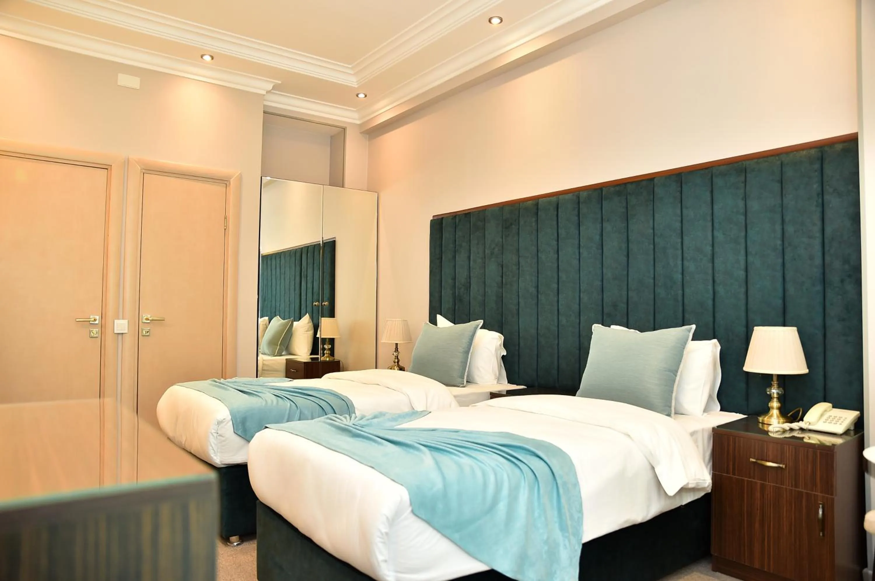 Bed in Karat Inn Boutique Hotel