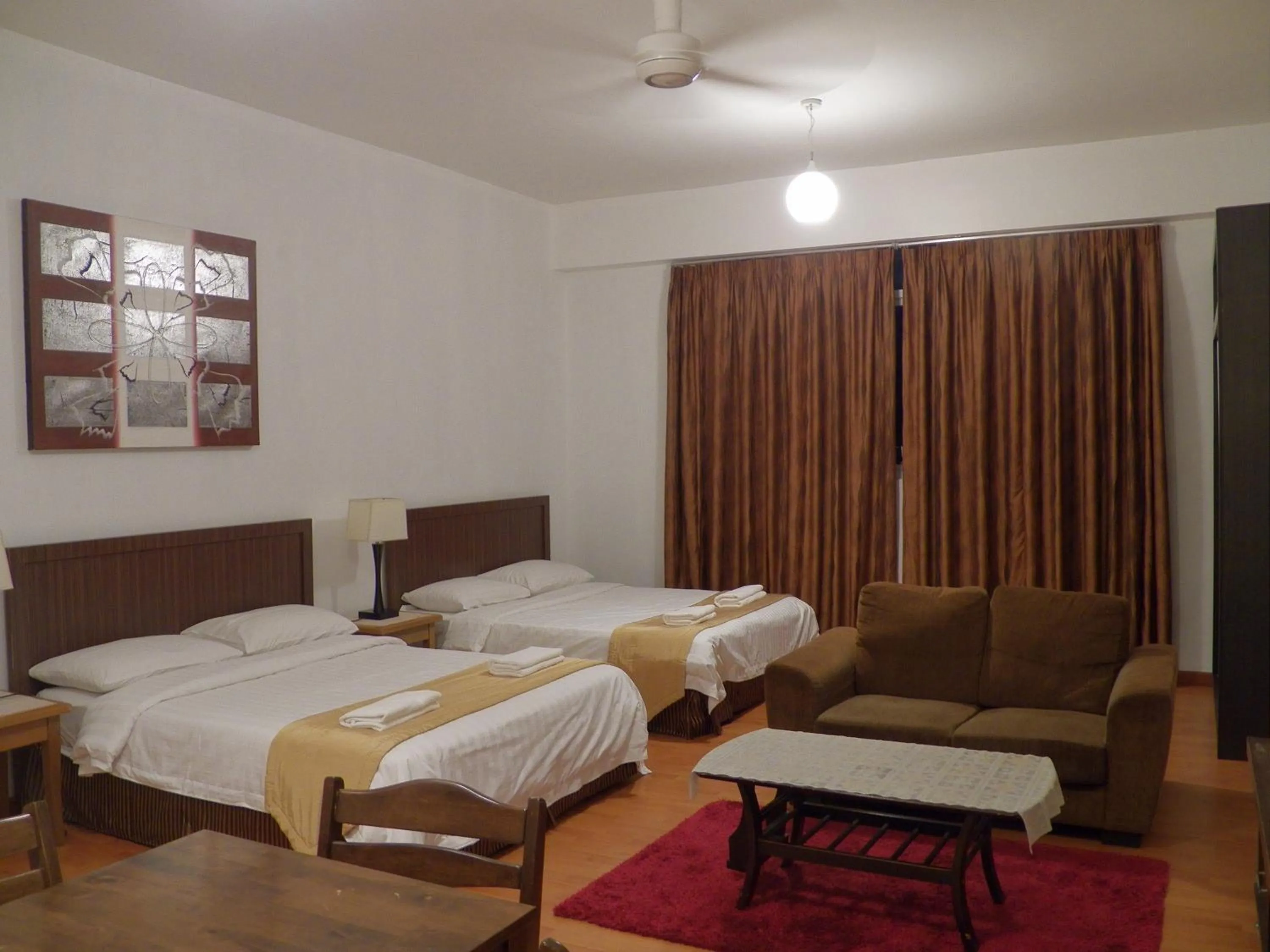 Bed in Maytower Apartment