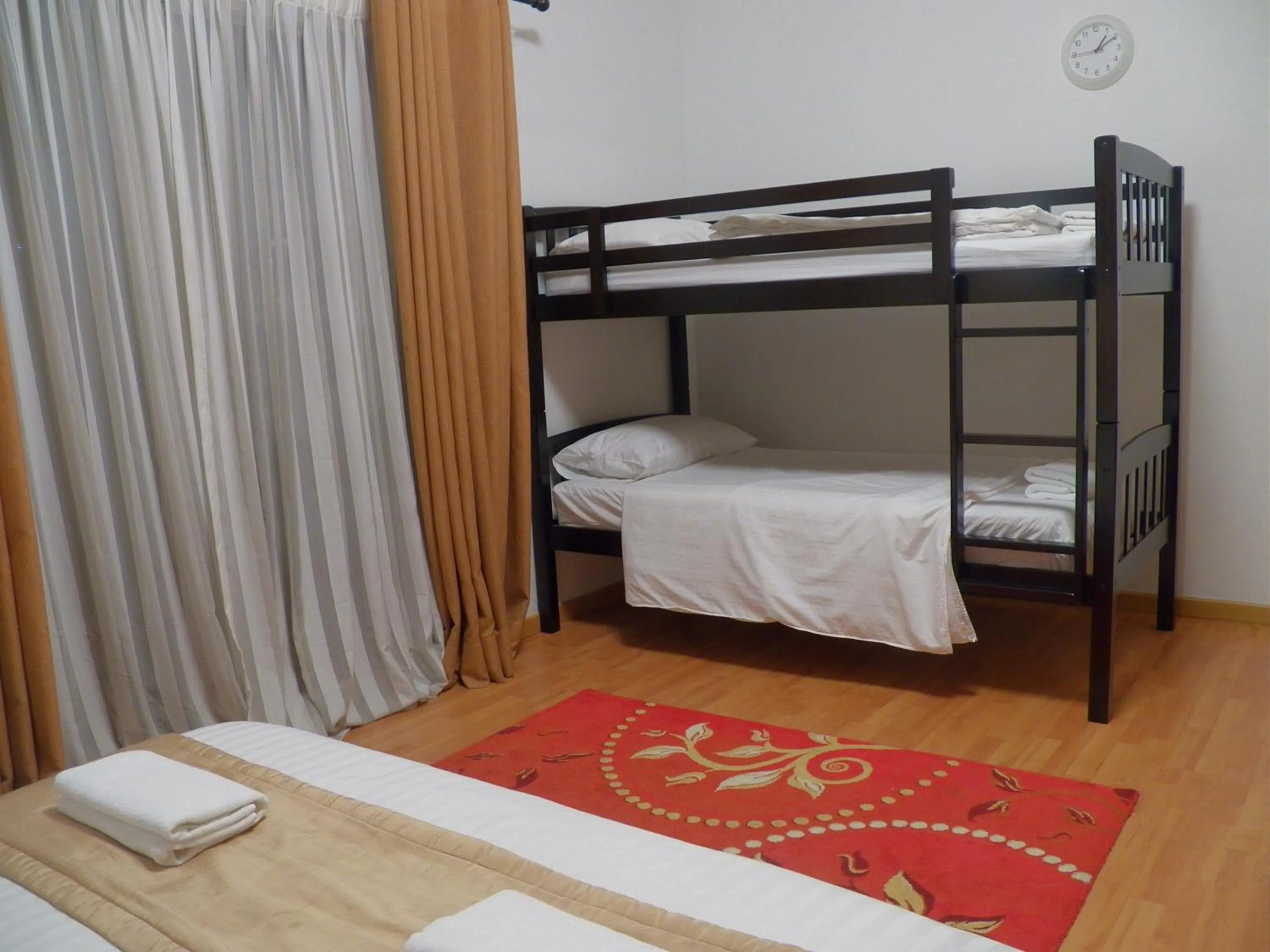 Bed in Maytower Apartment