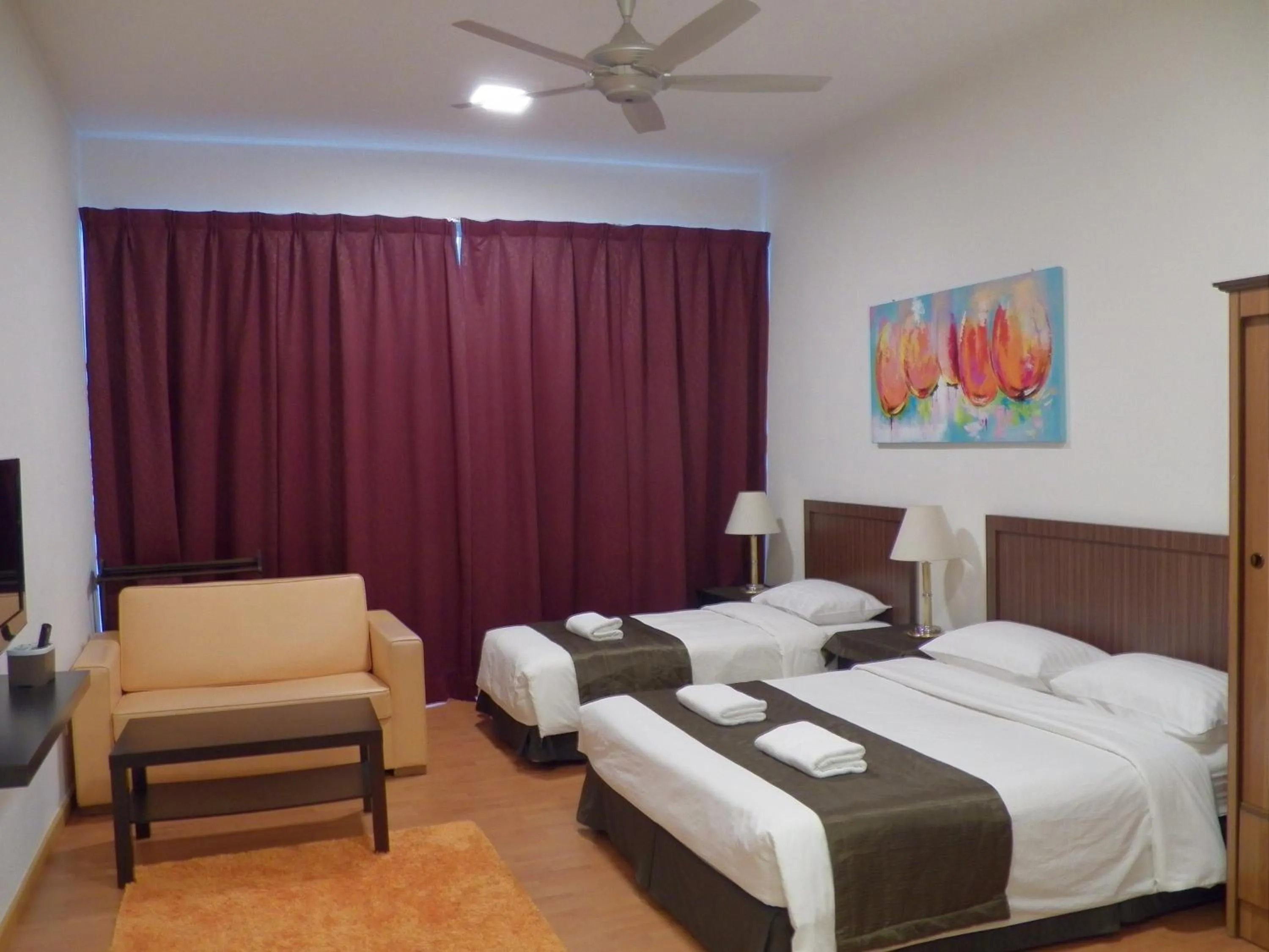 Bed in Maytower Apartment