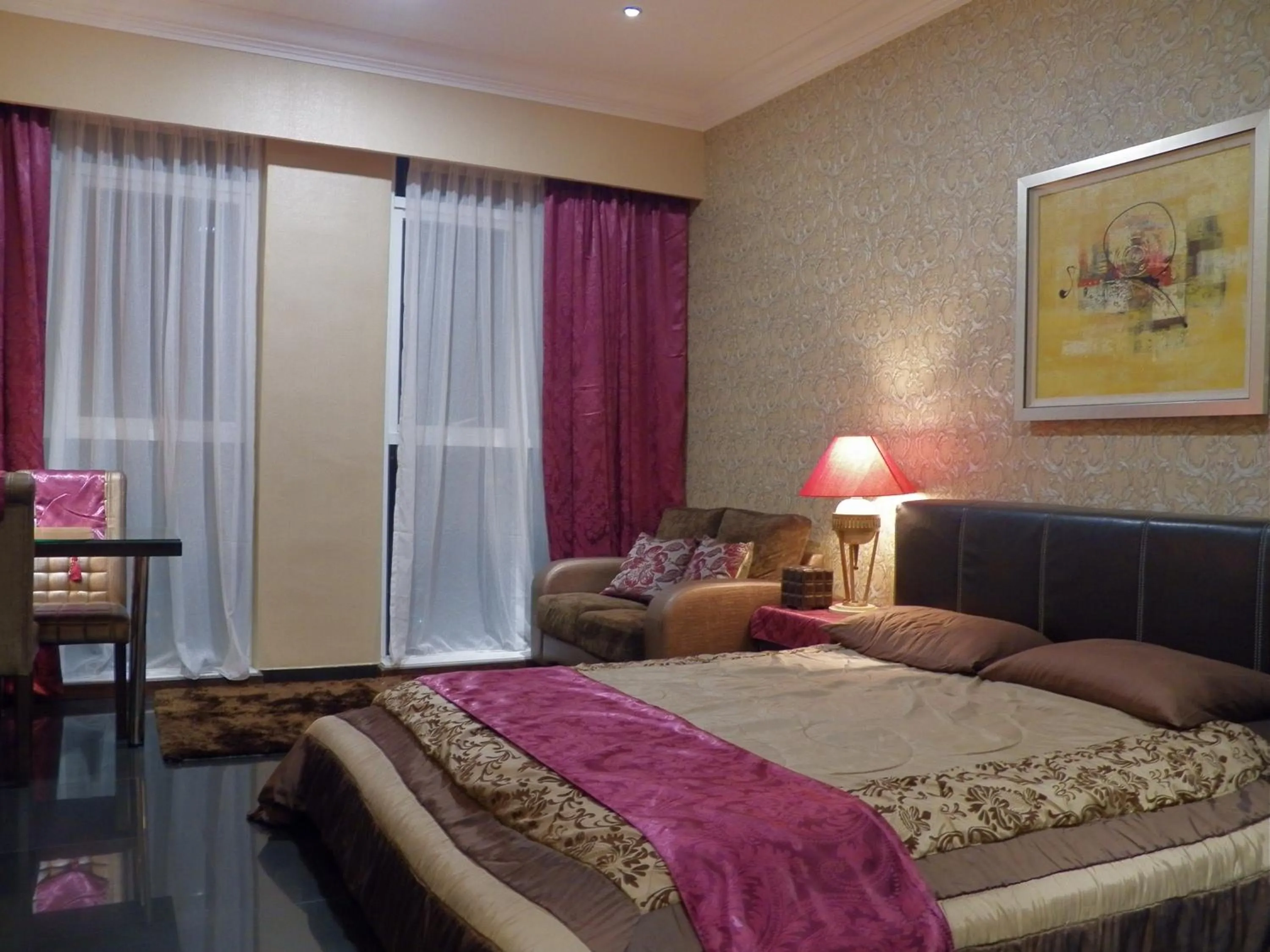 Bed in Maytower Apartment